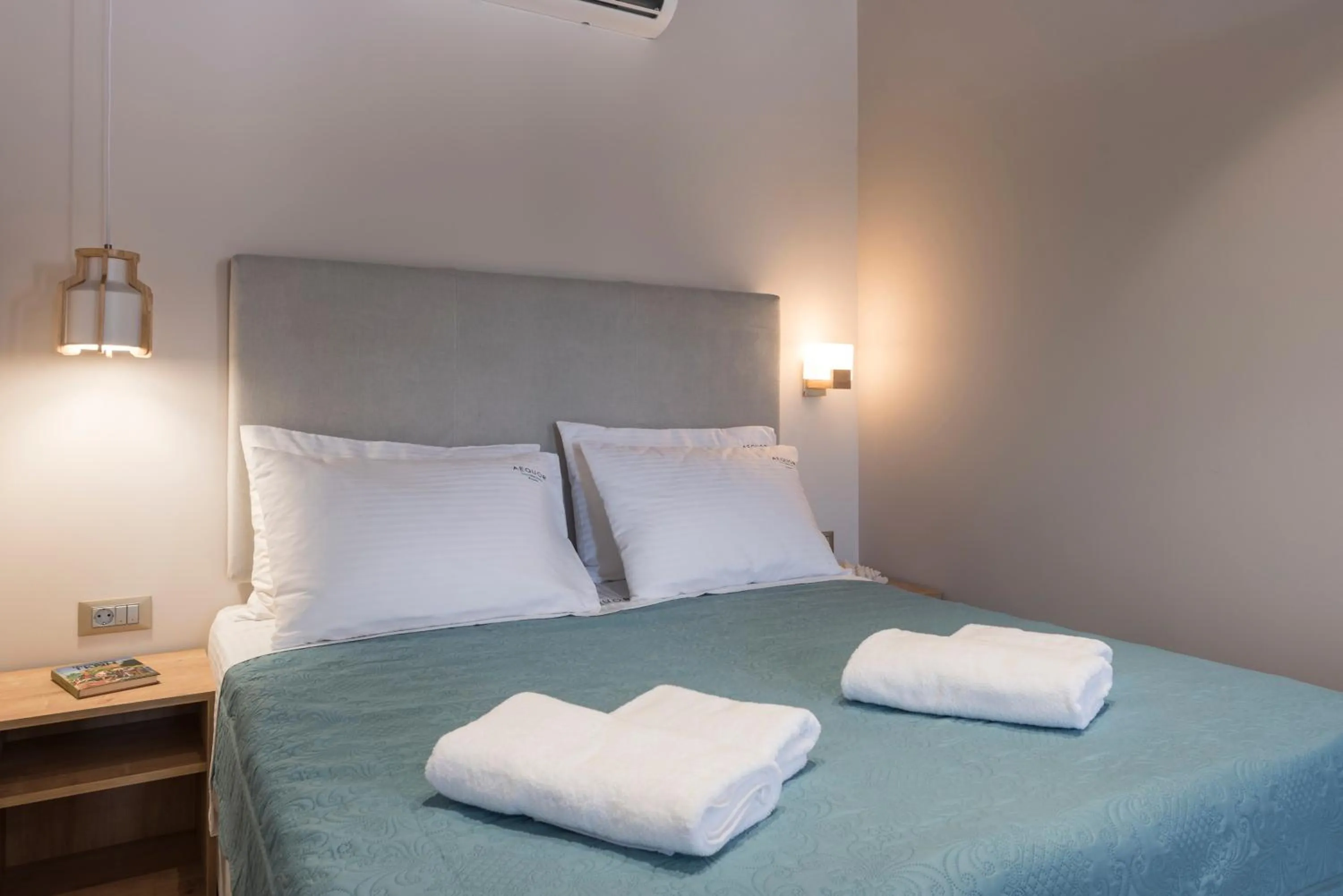 Bed in Aequor Luxury Rooms & Apartments