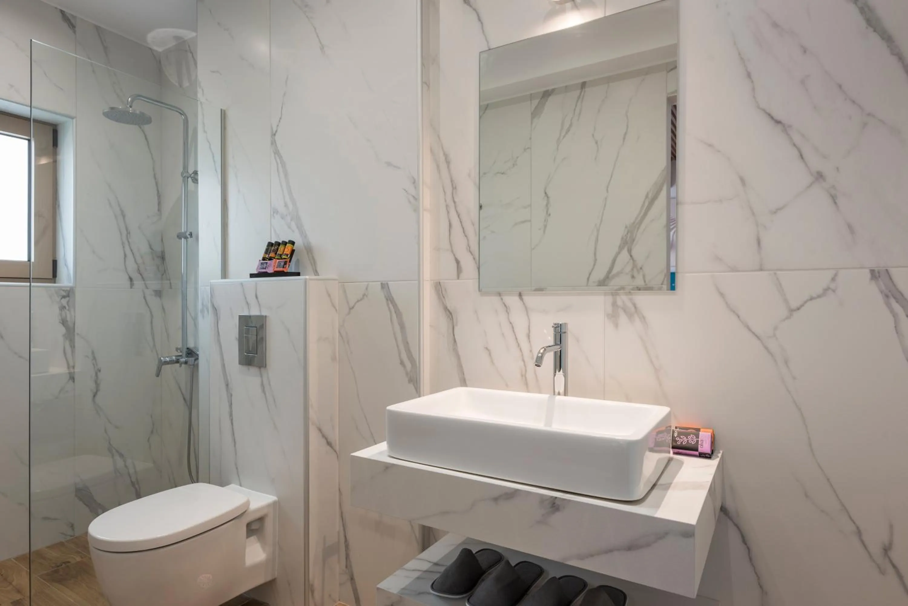 Toilet in Aequor Luxury Rooms & Apartments