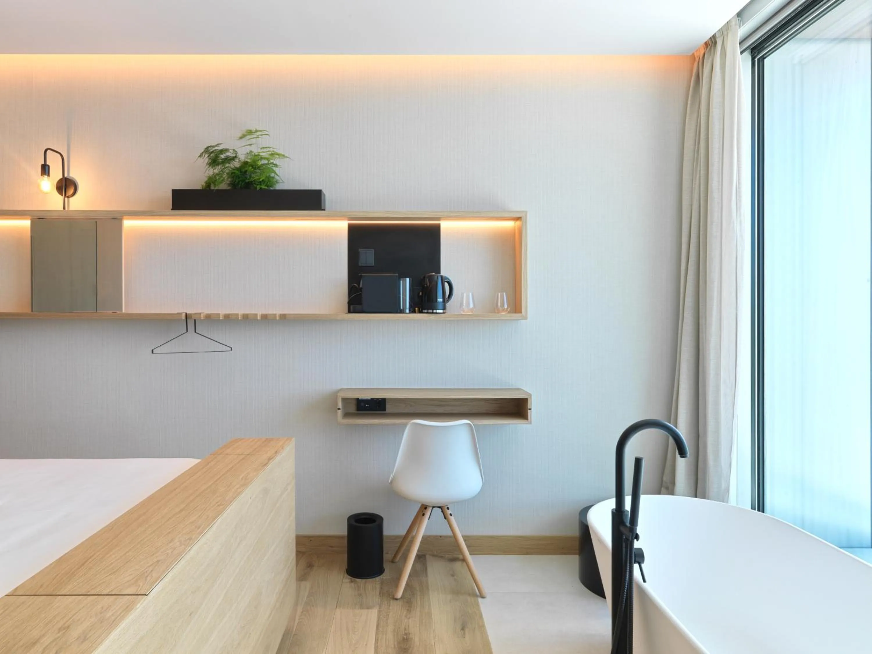 Seating area, Bed in Noa Boutique Hotel