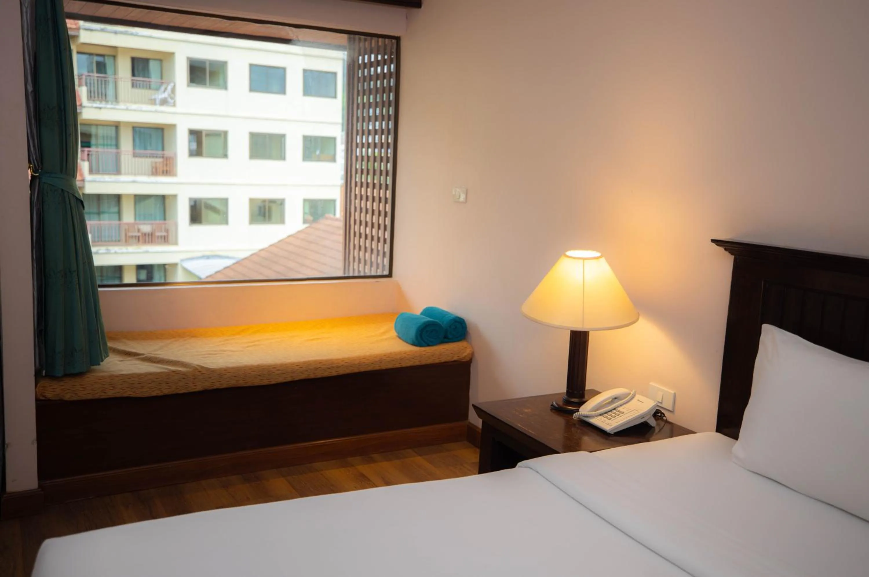 Bed in Baumanburi Hotel Patong