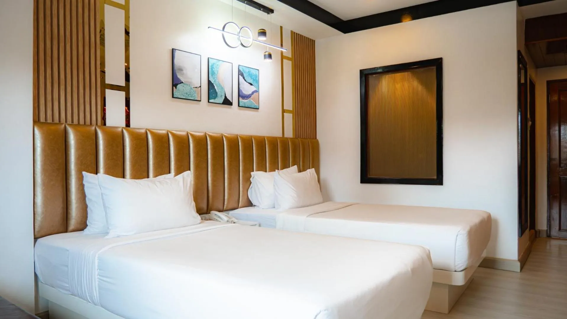 Bed in Baumanburi Hotel Patong