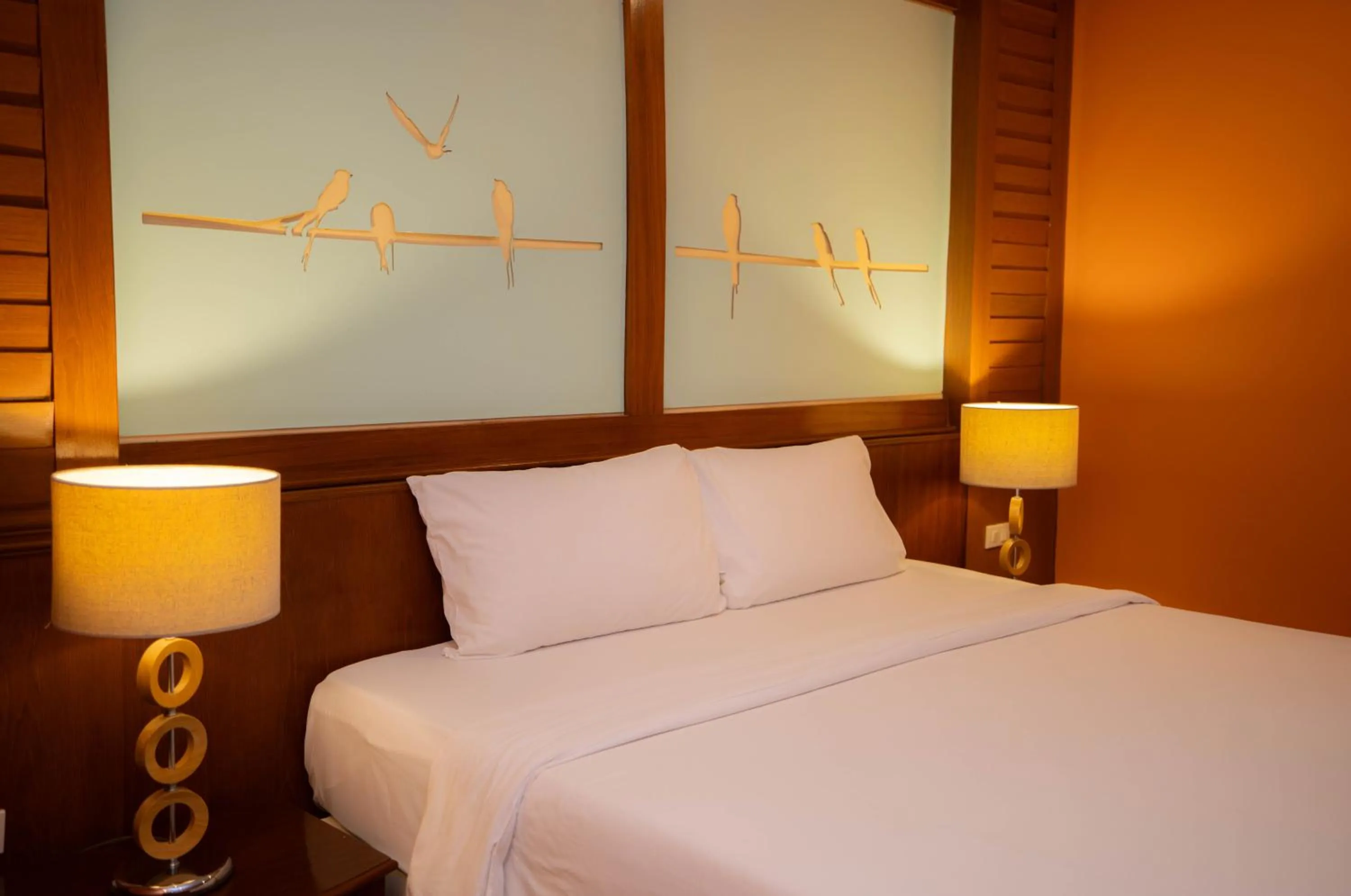 Bed in Baumanburi Hotel Patong