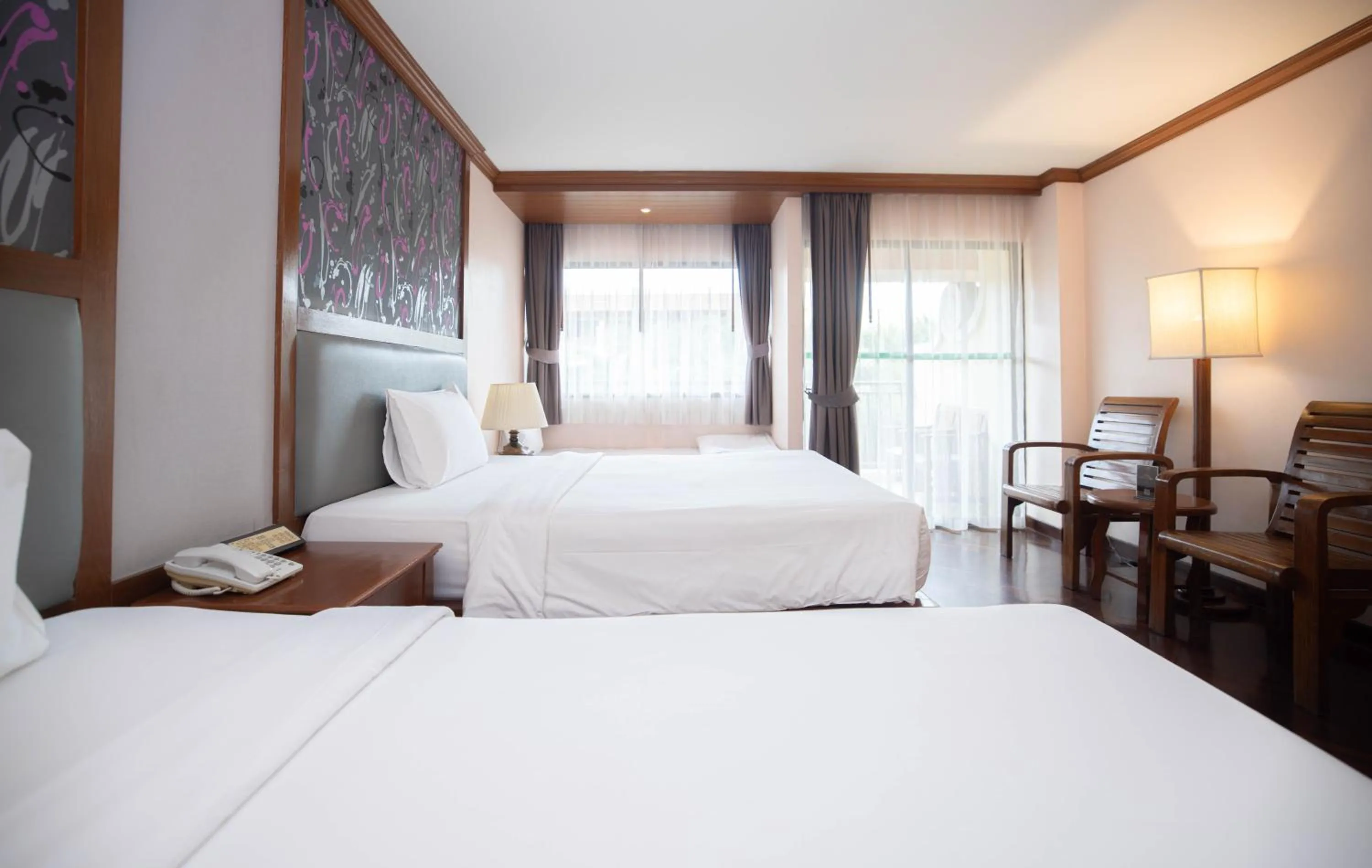 Bed in Baumanburi Hotel Patong