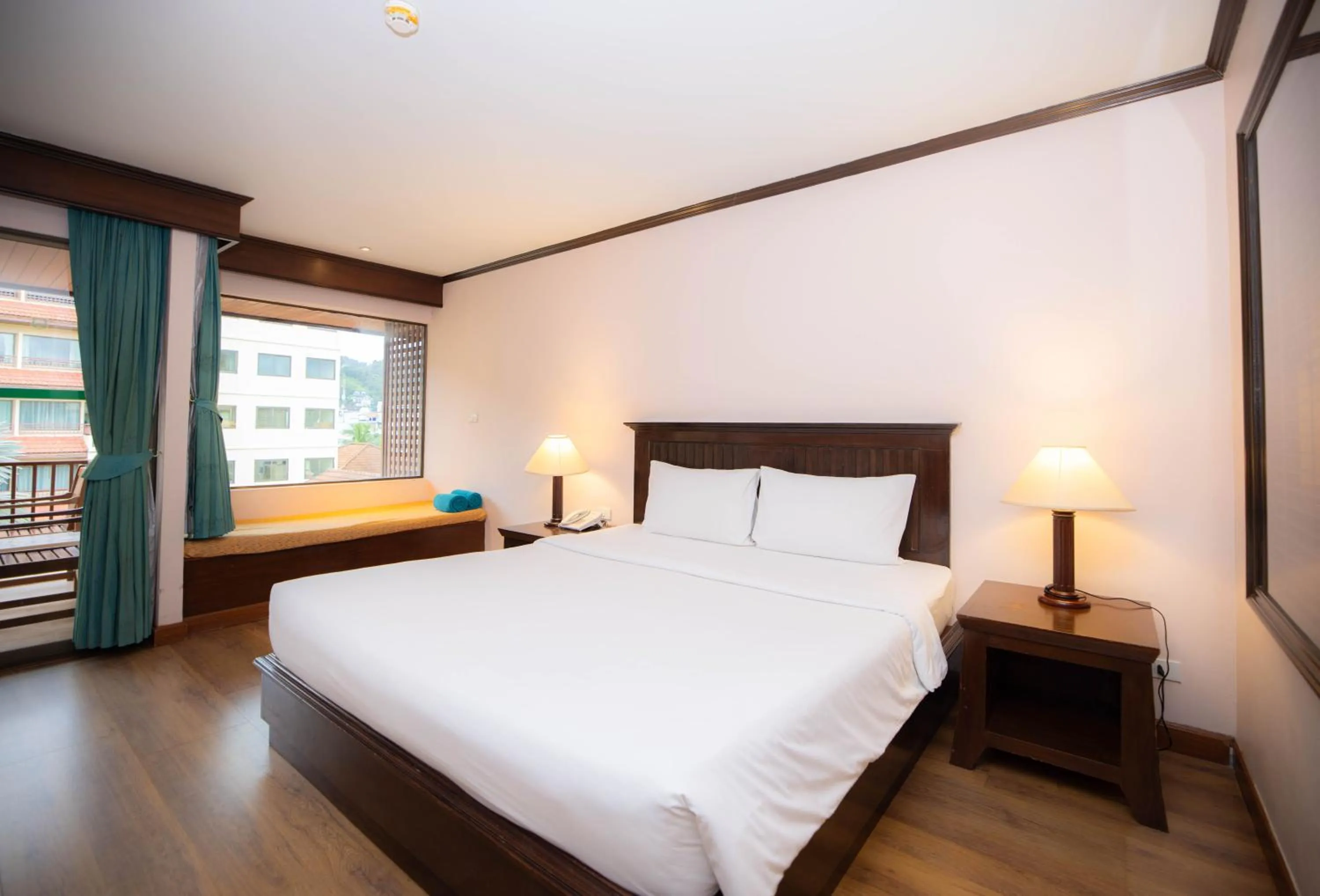 Bed in Baumanburi Hotel Patong