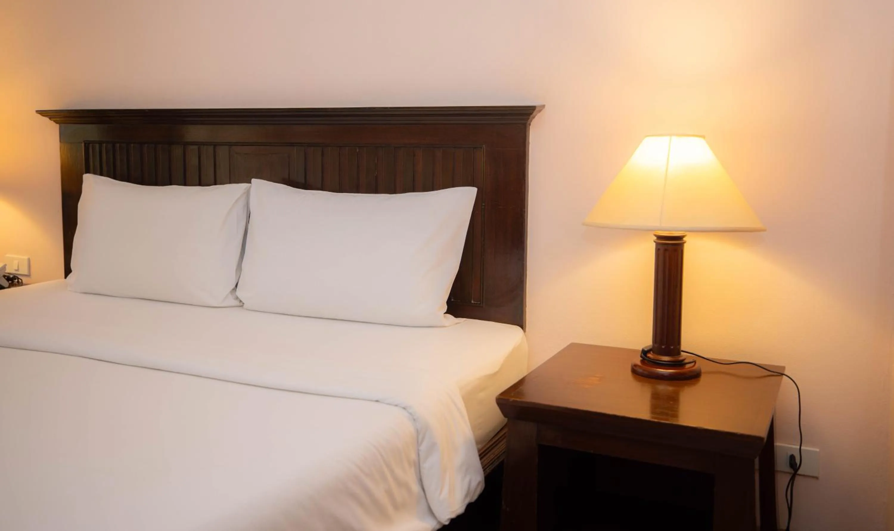 Bed in Baumanburi Hotel Patong