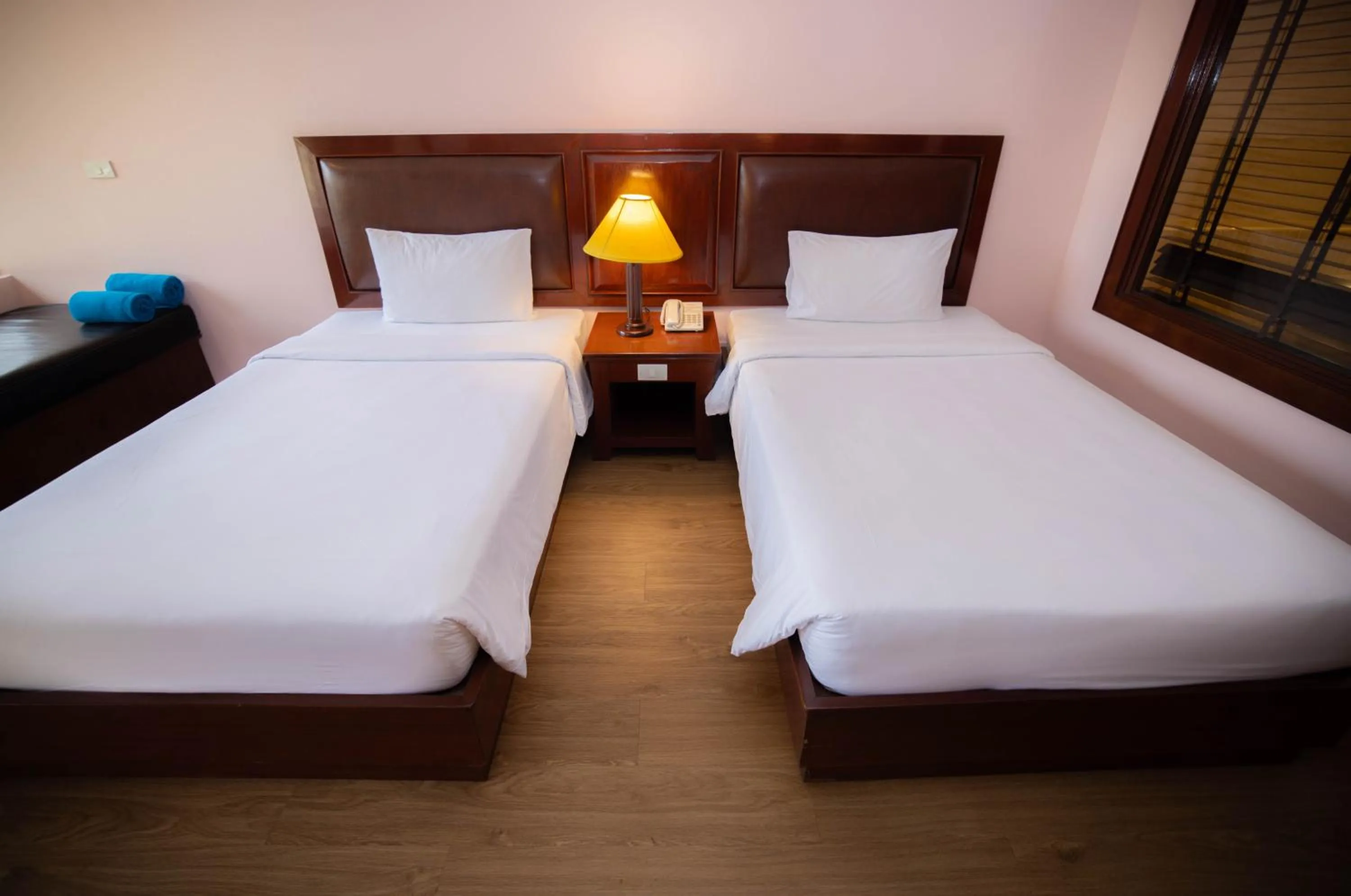 Bed in Baumanburi Hotel Patong