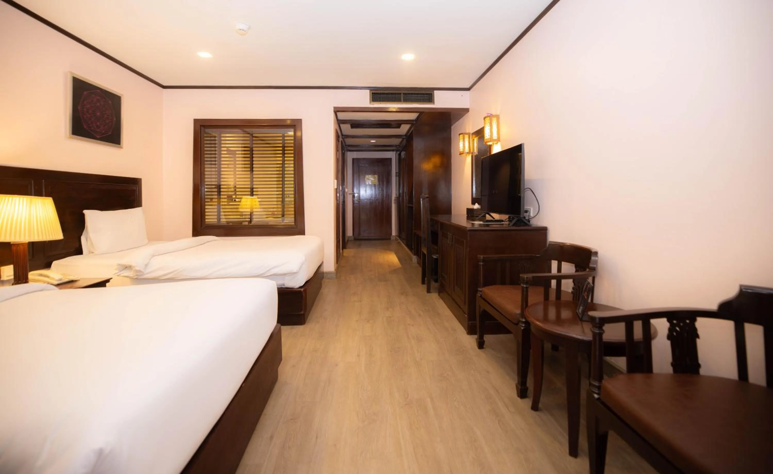 Bed in Baumanburi Hotel Patong