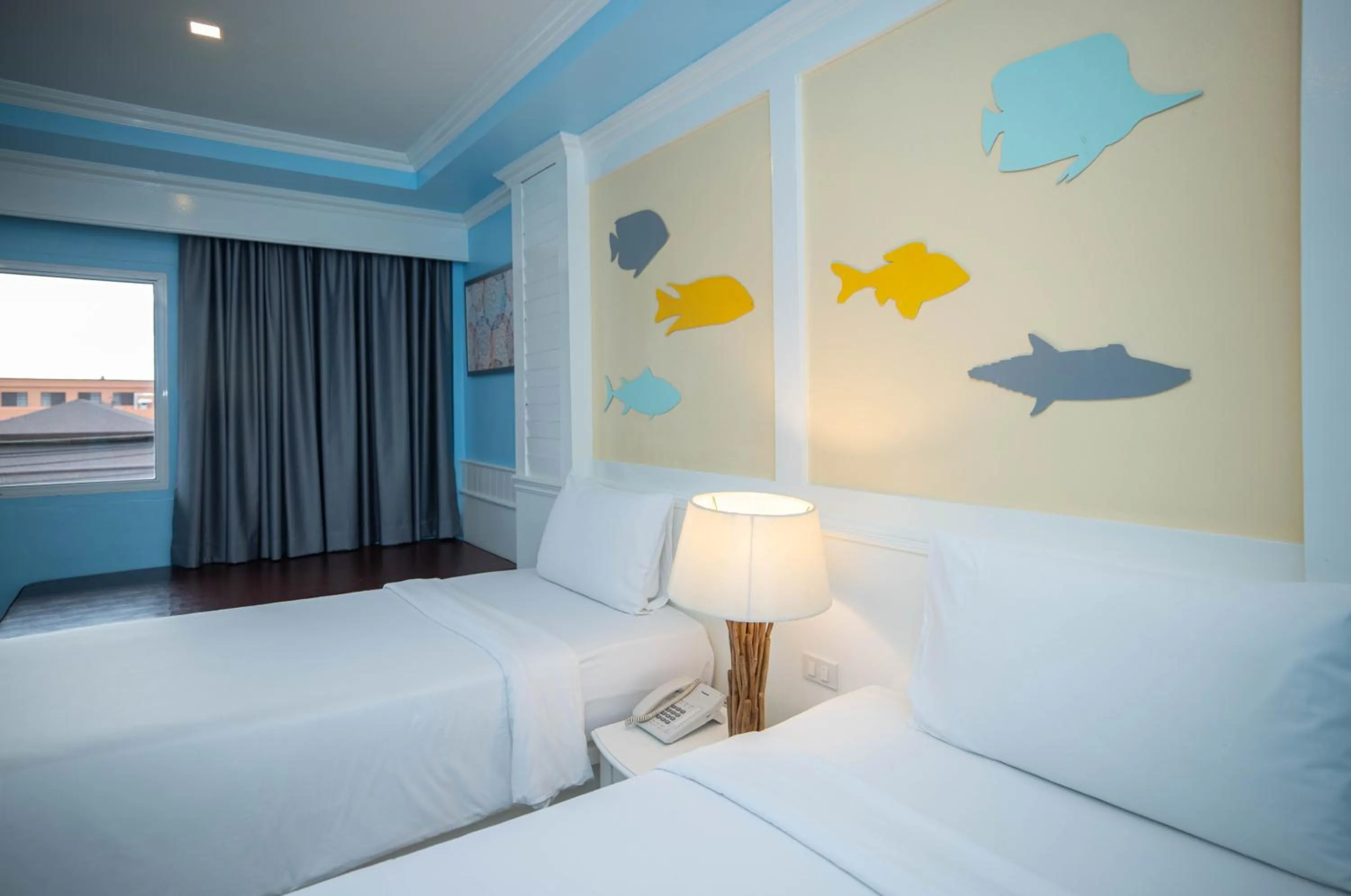 Bed in Baumanburi Hotel Patong