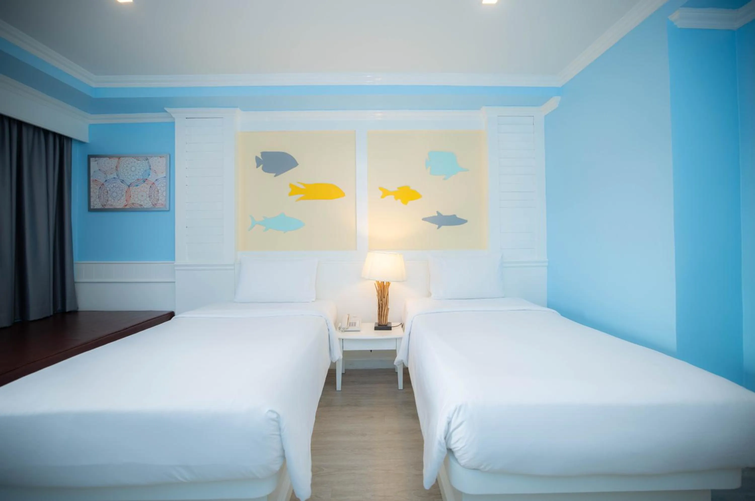 Bed in Baumanburi Hotel Patong