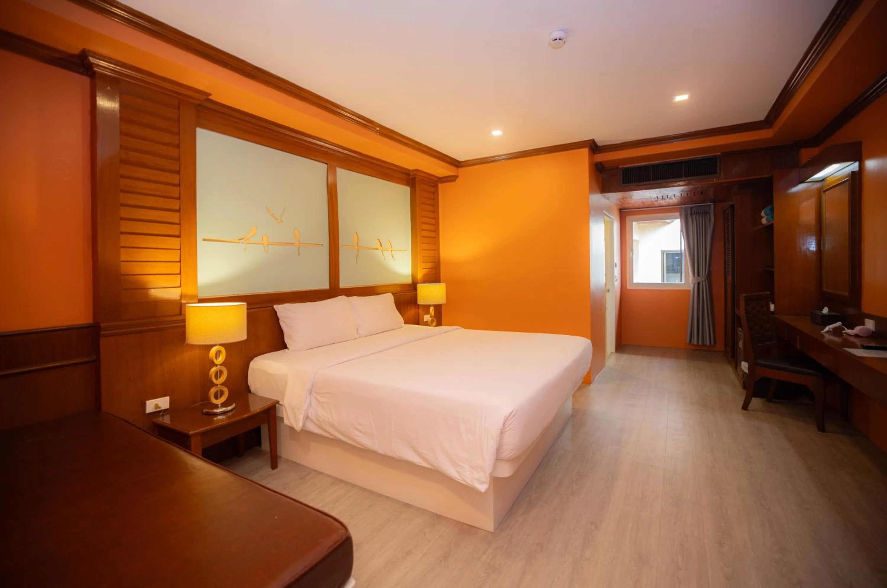 Bed in Baumanburi Hotel Patong