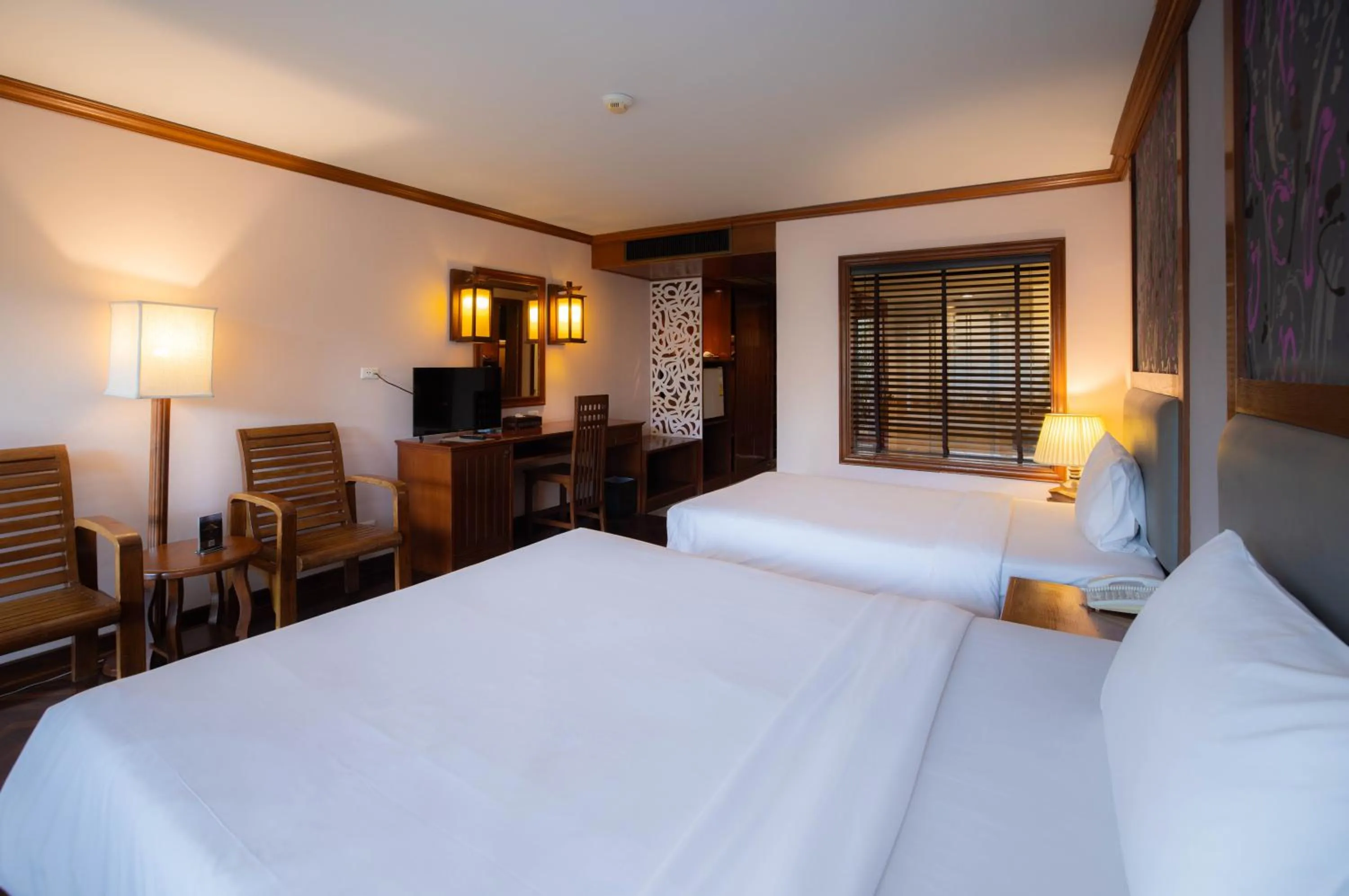 Bed in Baumanburi Hotel Patong