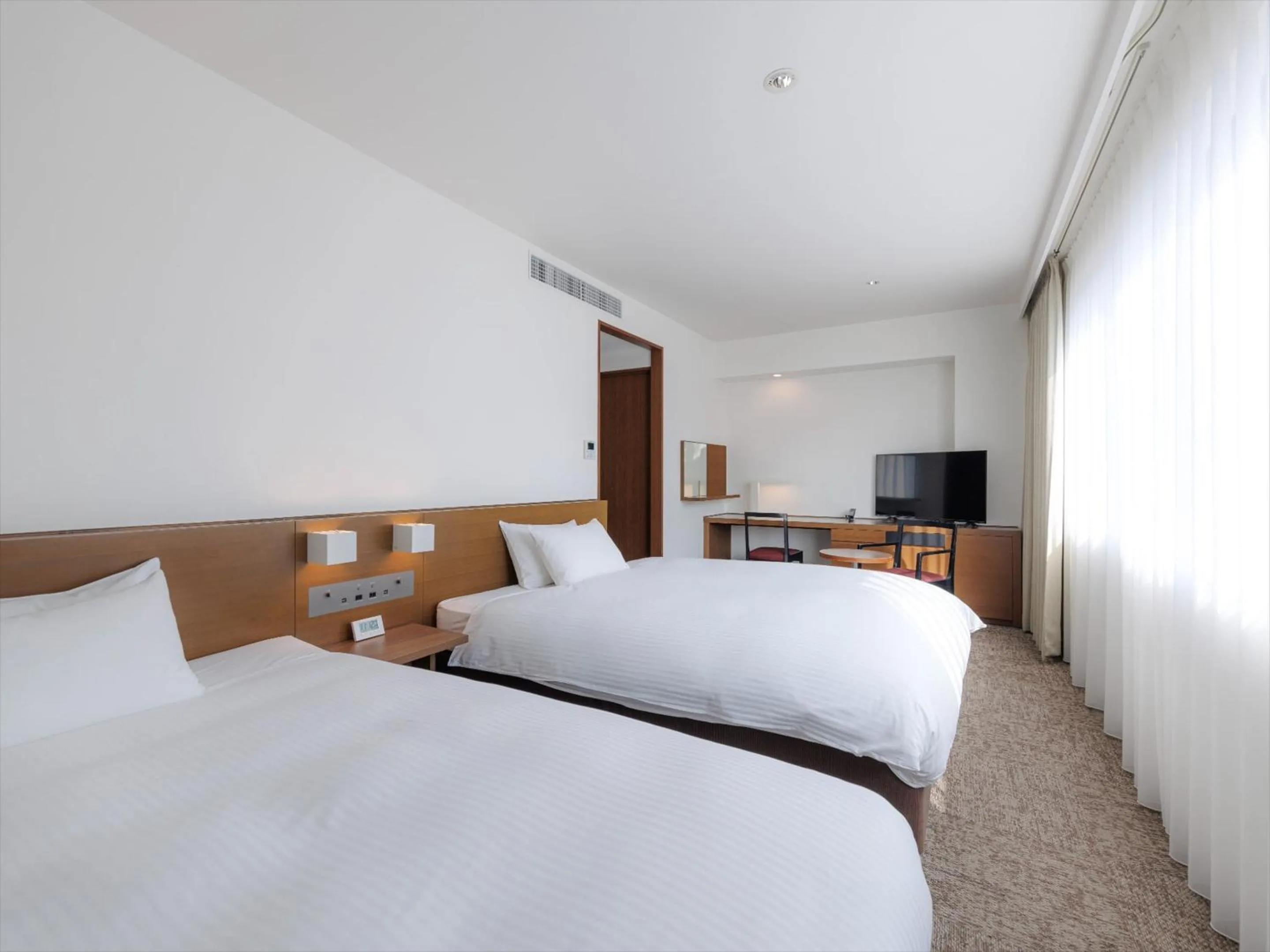 Photo of the whole room, Bed in JR Kyushu Hotel Kagoshima