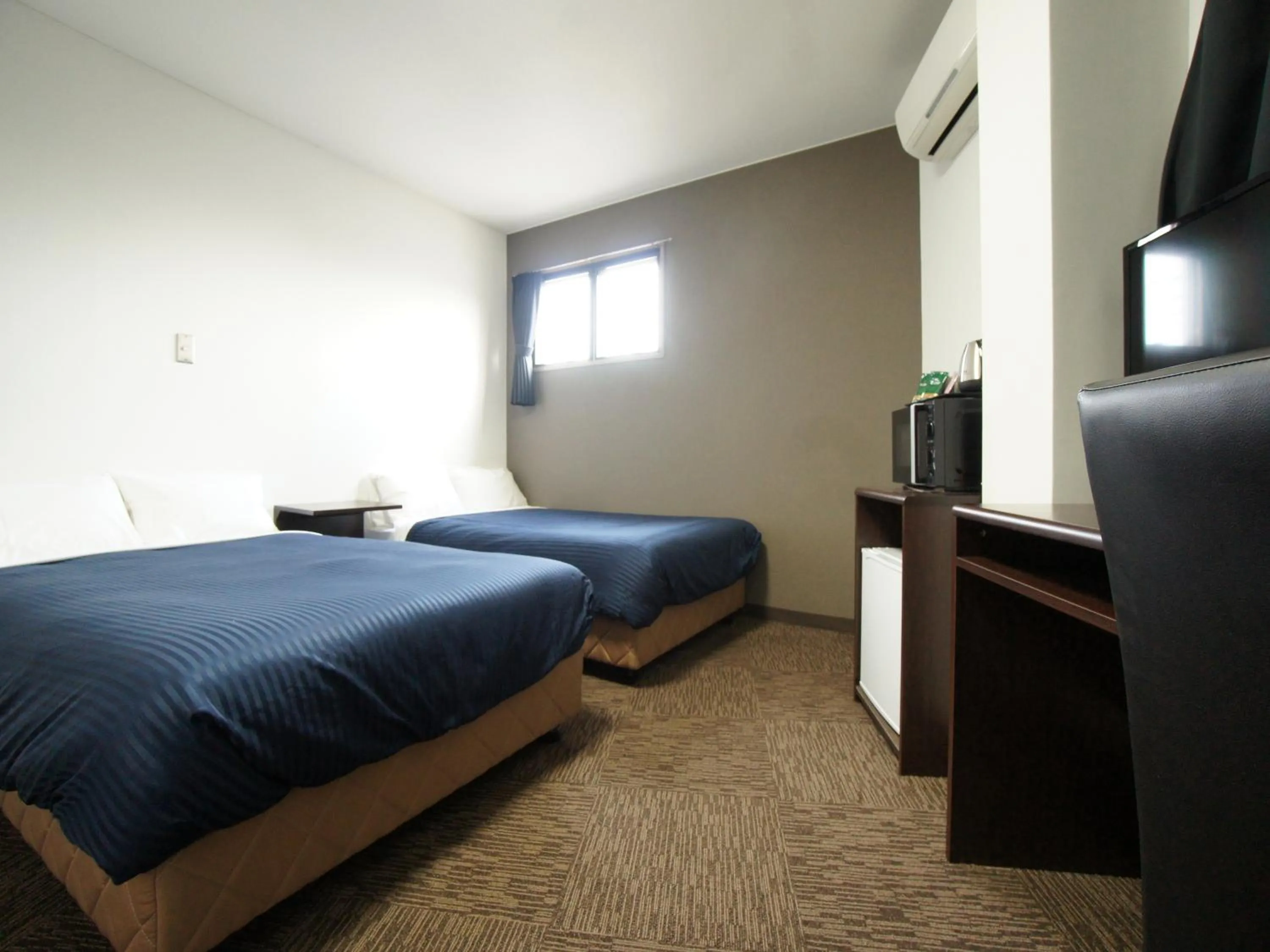 Bed in HOTEL LiVEMAX BUDGET Gunma Numata