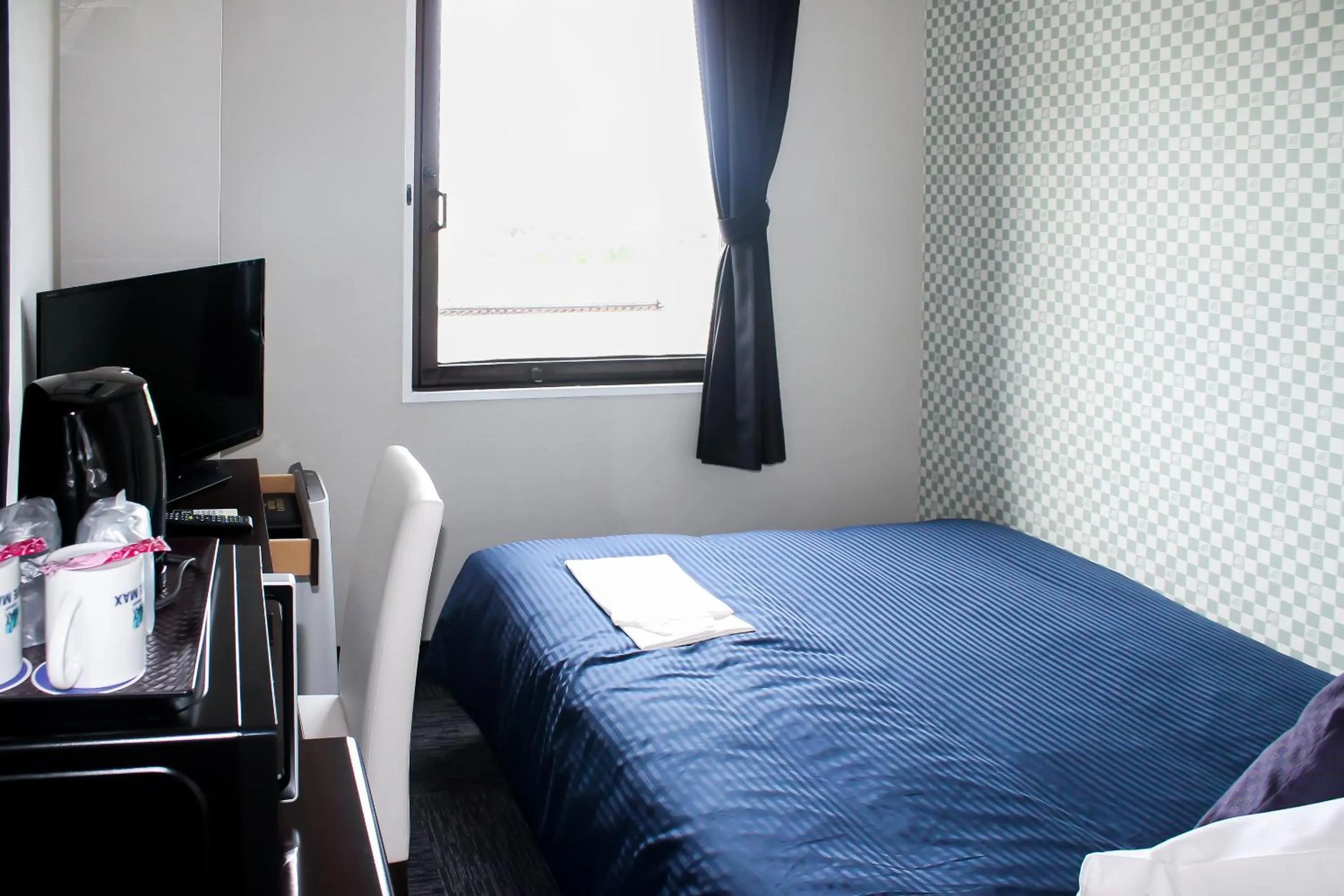 Photo of the whole room, Bed in Hotel Livemax BUDGET Kanazawa-Idaimae