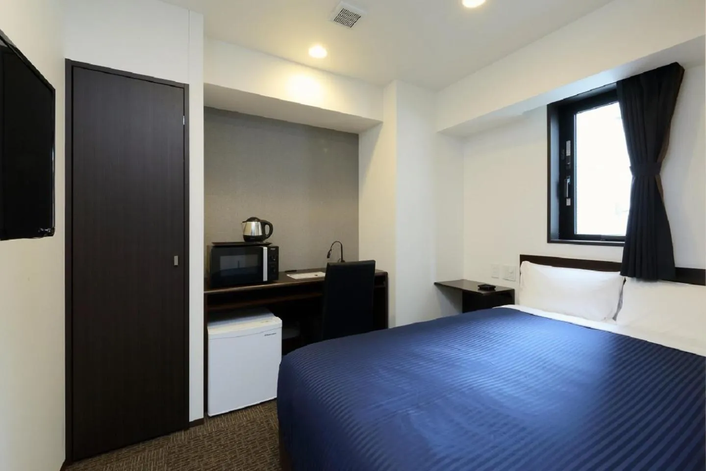 Bed in HOTEL LiVEMAX Meieki