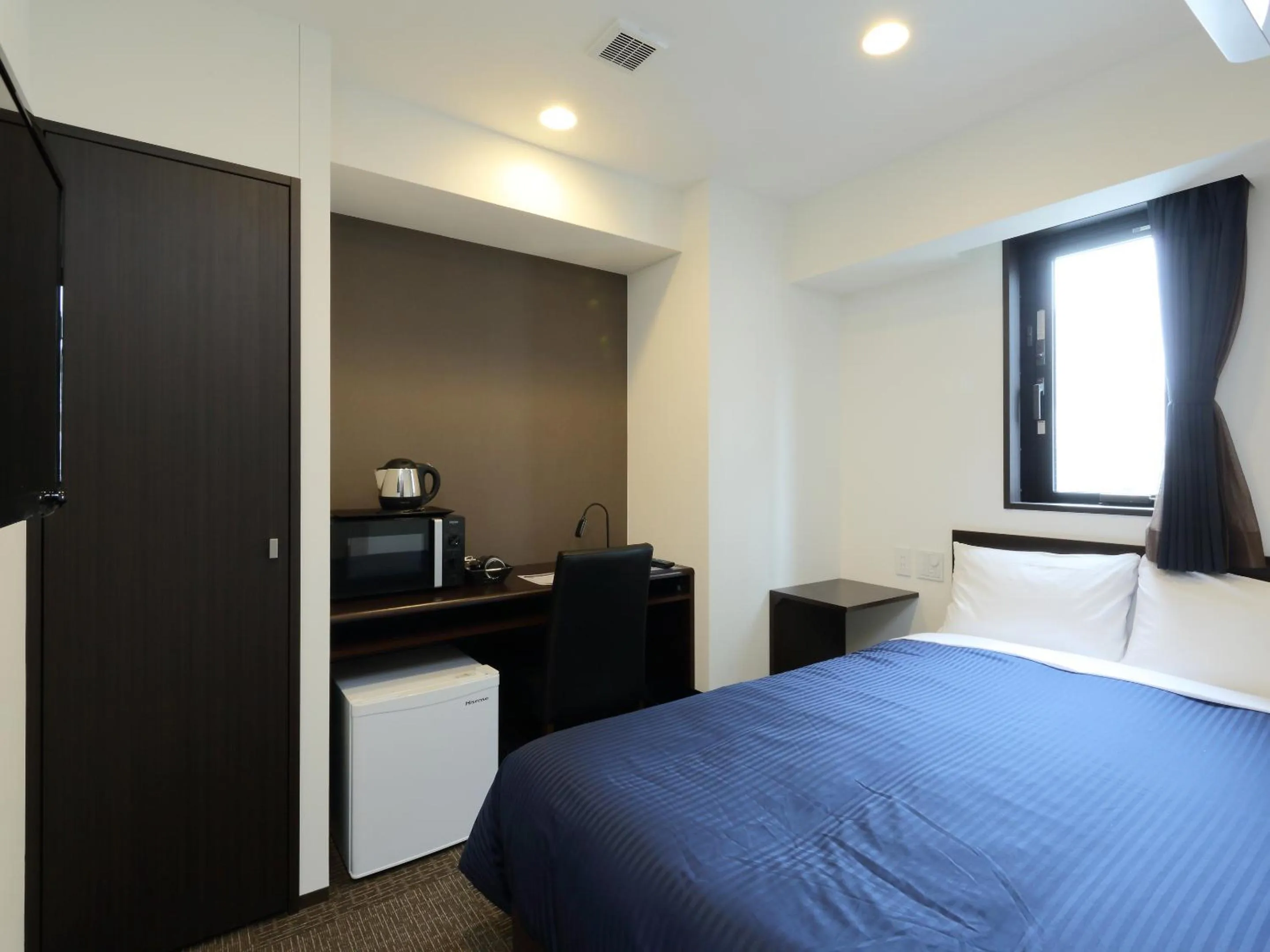 Bed in HOTEL LiVEMAX Meieki