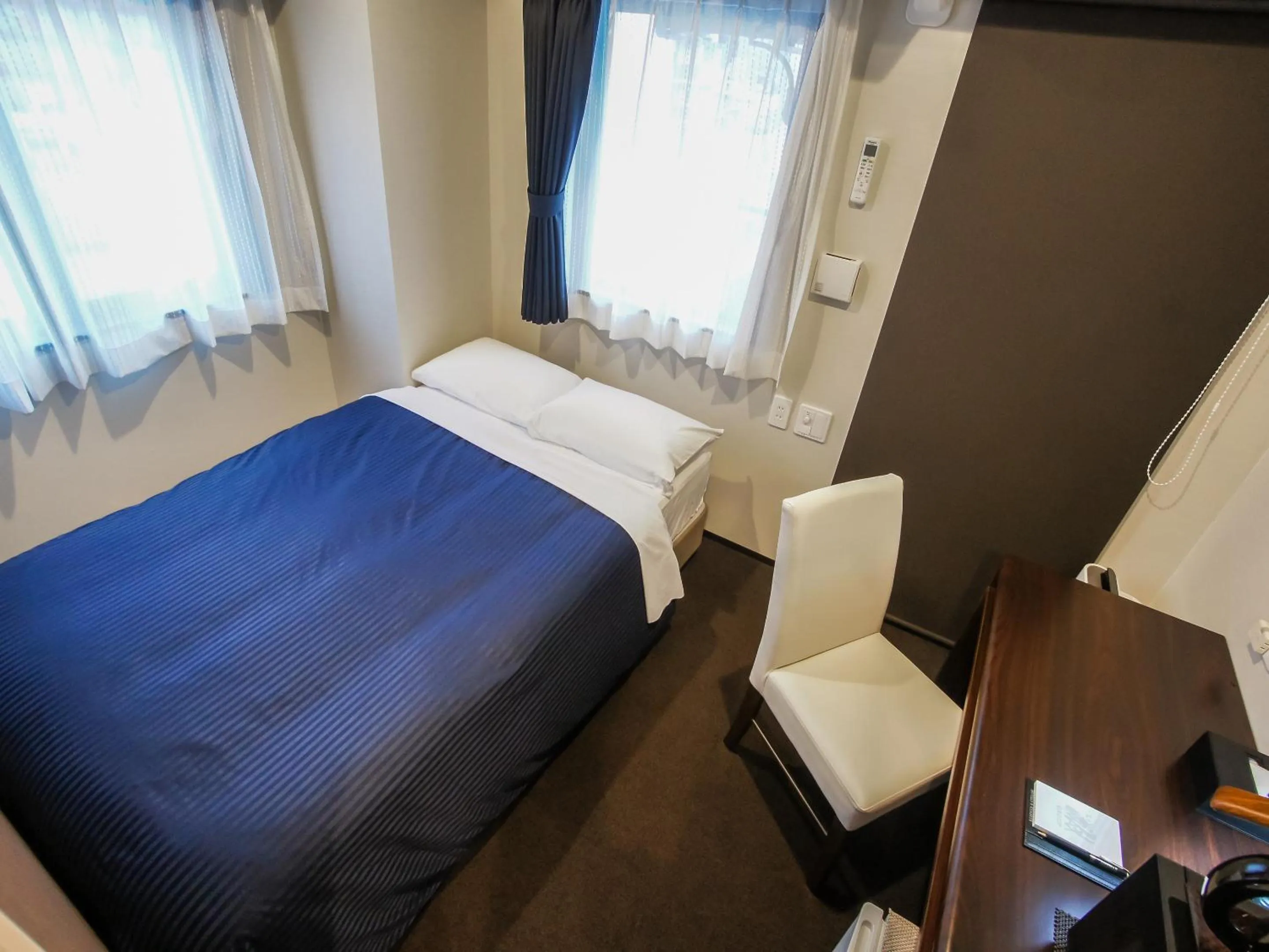 Bed in HOTEL LiVEMAX Umeda Doyama