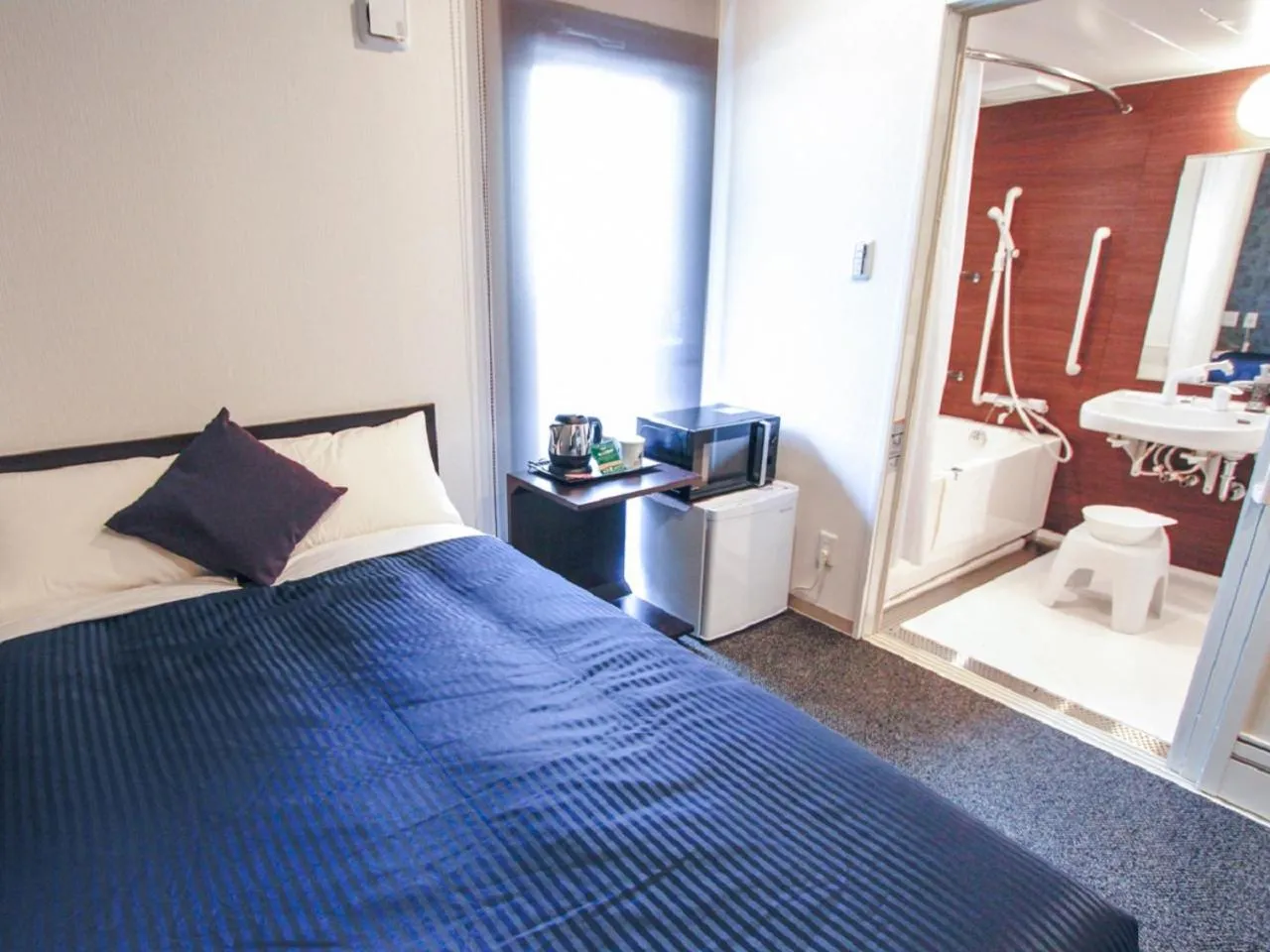 Bed in HOTEL LiVEMAX Kobe Sannomiya