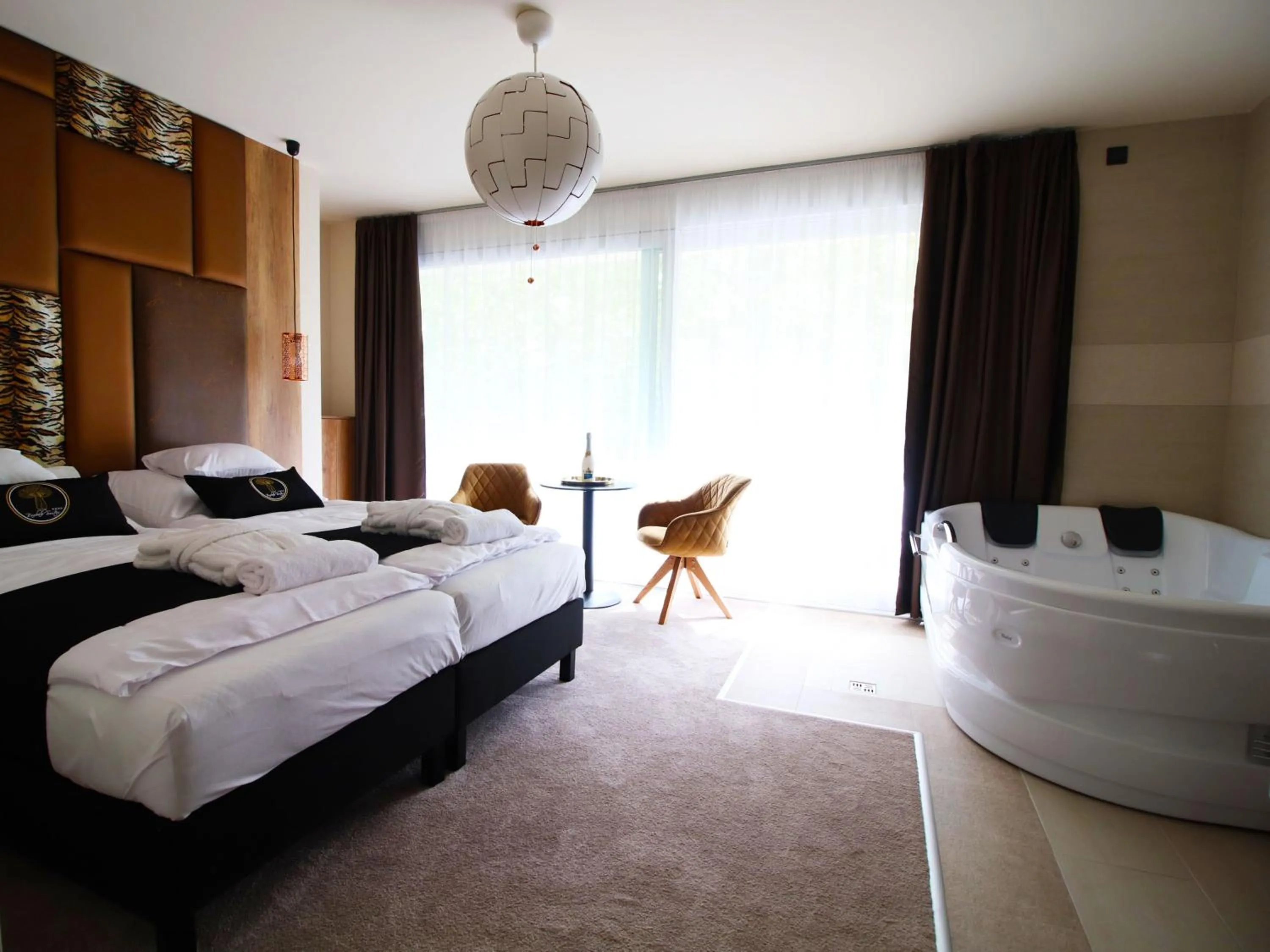 Photo of the whole room, Bed in Baobab Suites