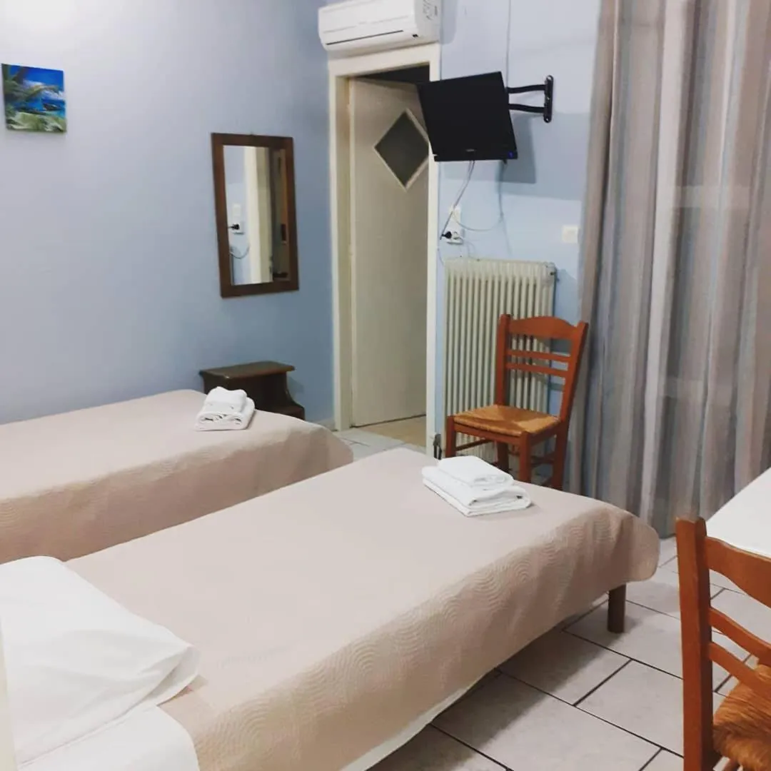 Bed in Almiriki Rooms