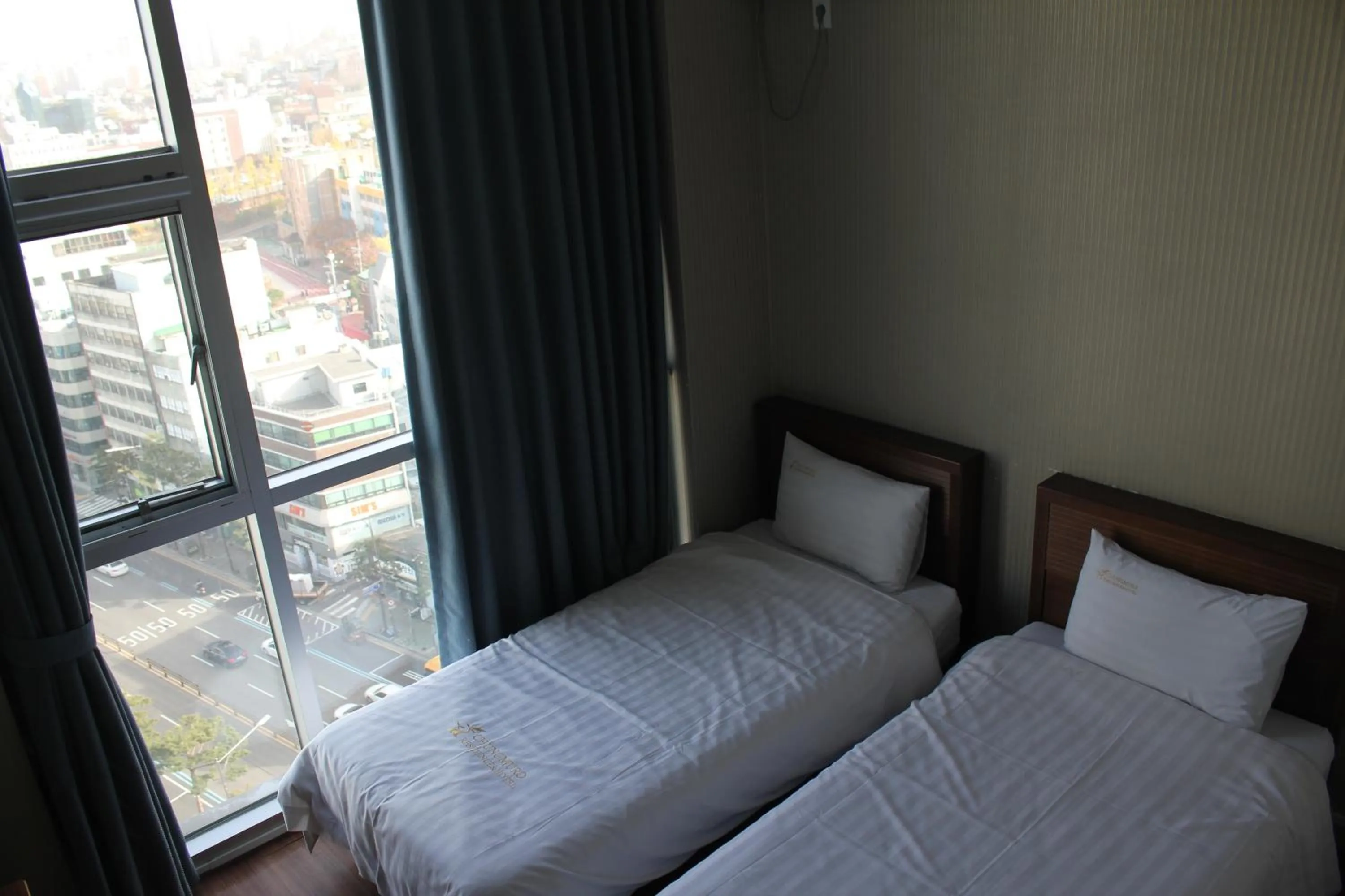 Bed in Myeongdong Merlin Hotel