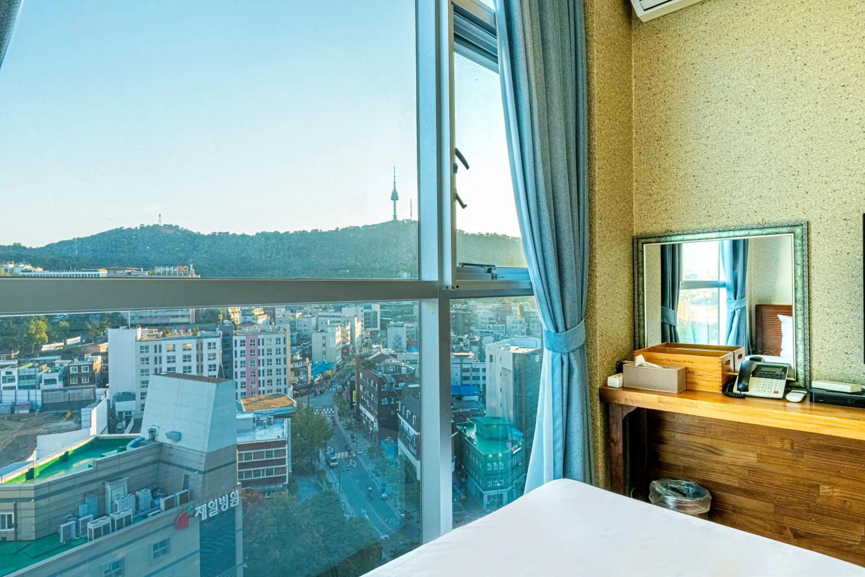Mountain view, Bed in Myeongdong Merlin Hotel