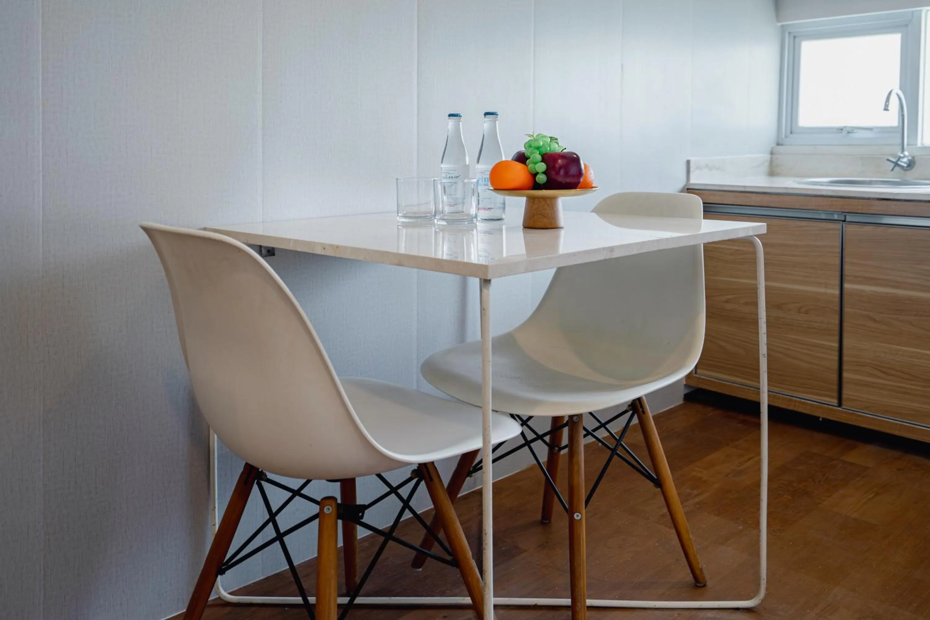 Dining area in The Rooms Apartment Bali by ARM Hospitality