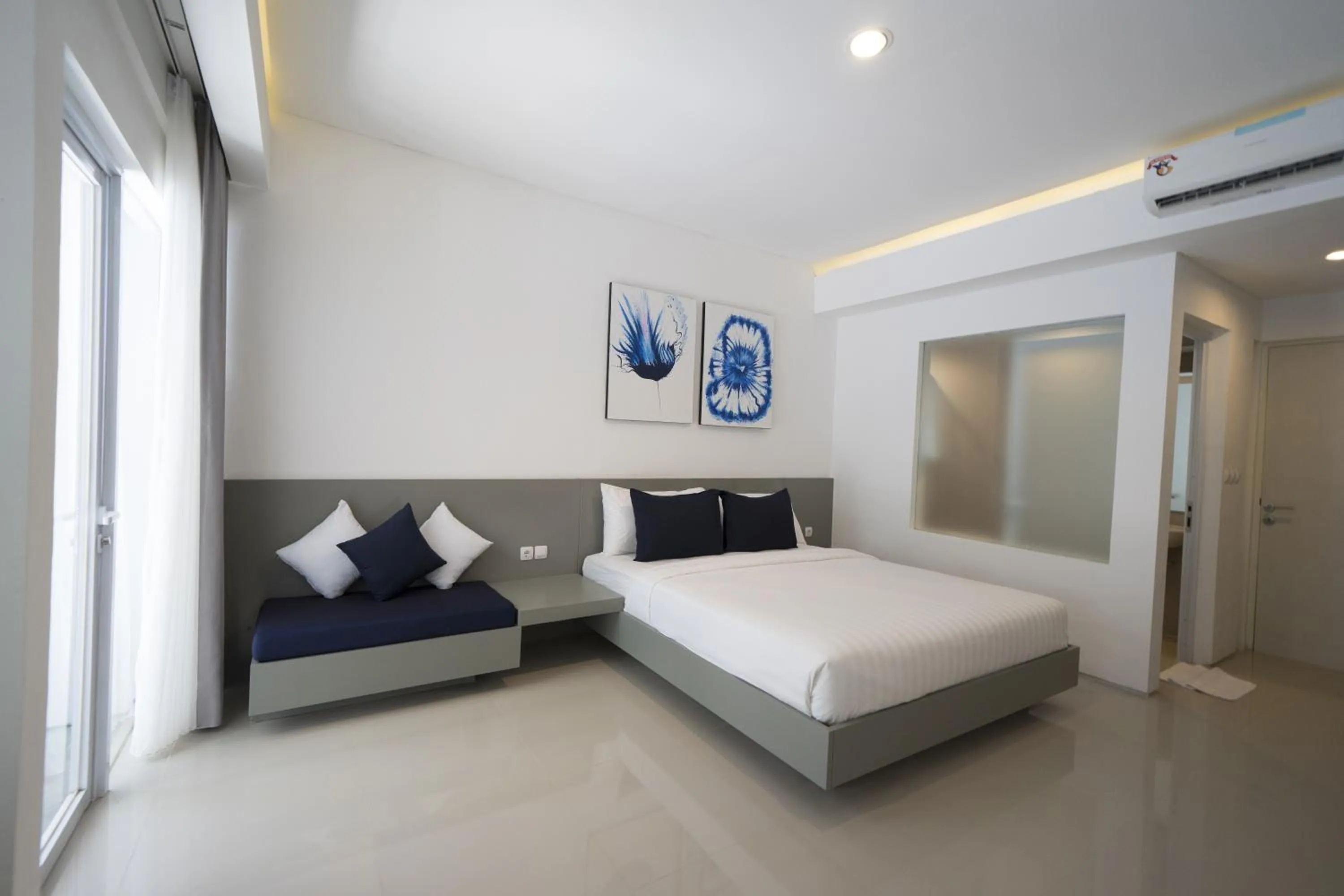 Bed in The Rooms Apartment Bali by ARM Hospitality