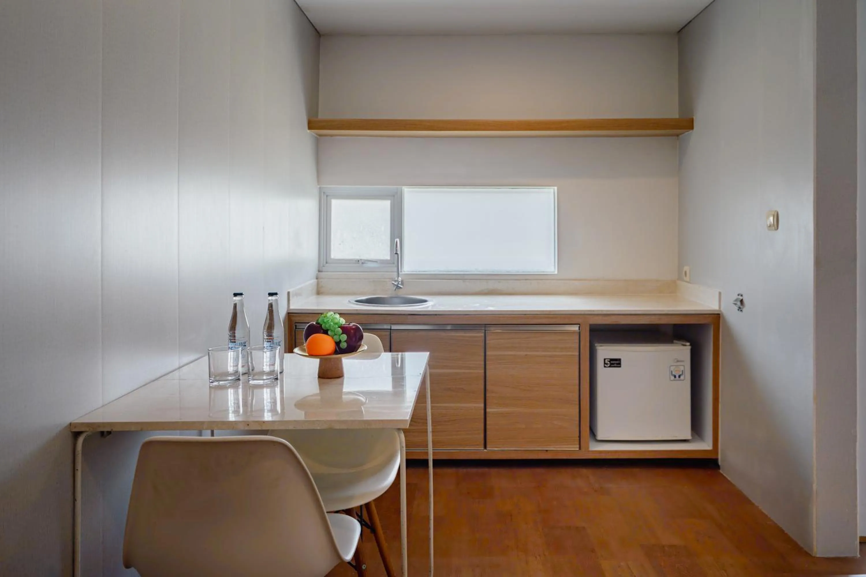 Kitchen or kitchenette in The Rooms Apartment Bali by ARM Hospitality