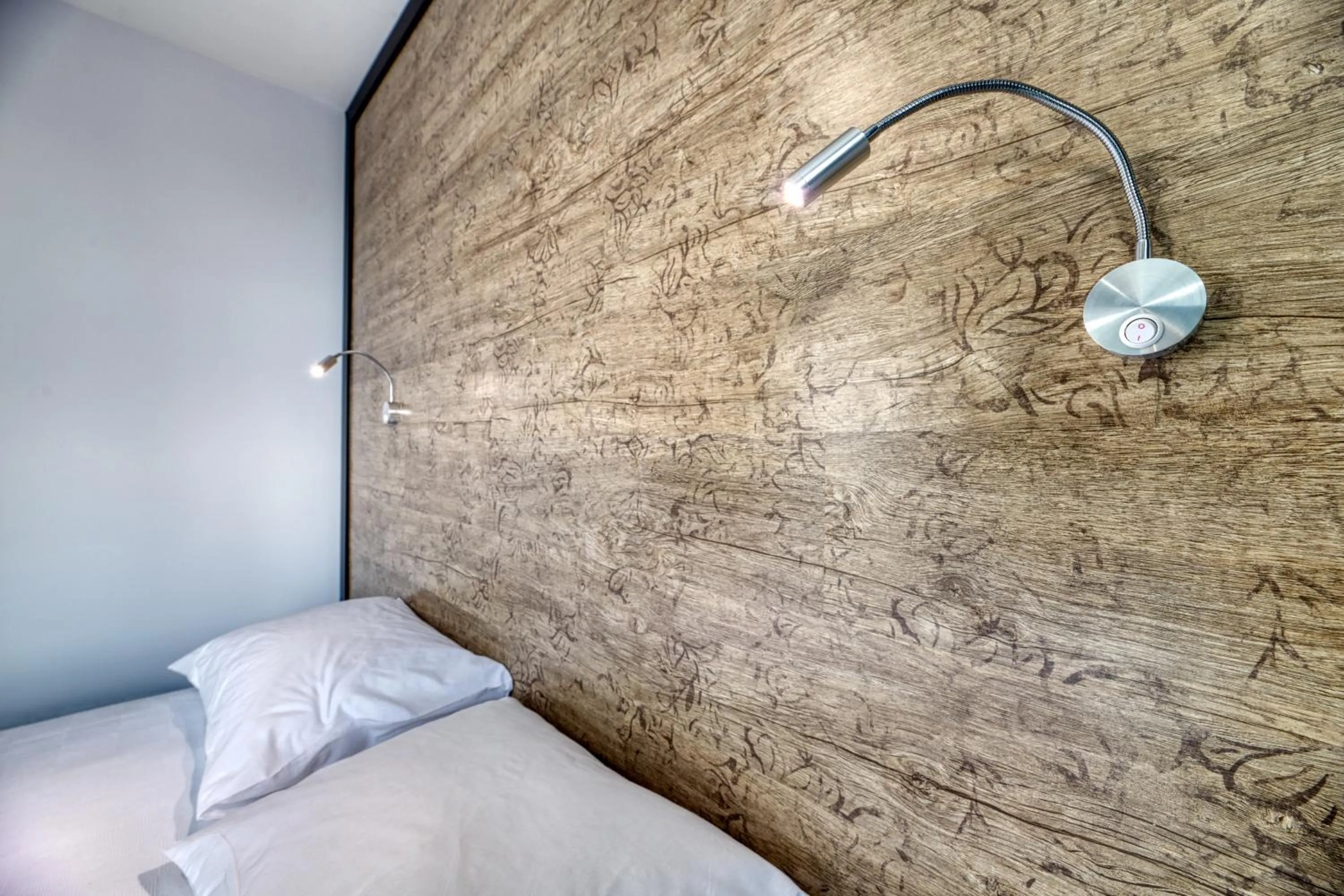 Bed in Grisverde Suites