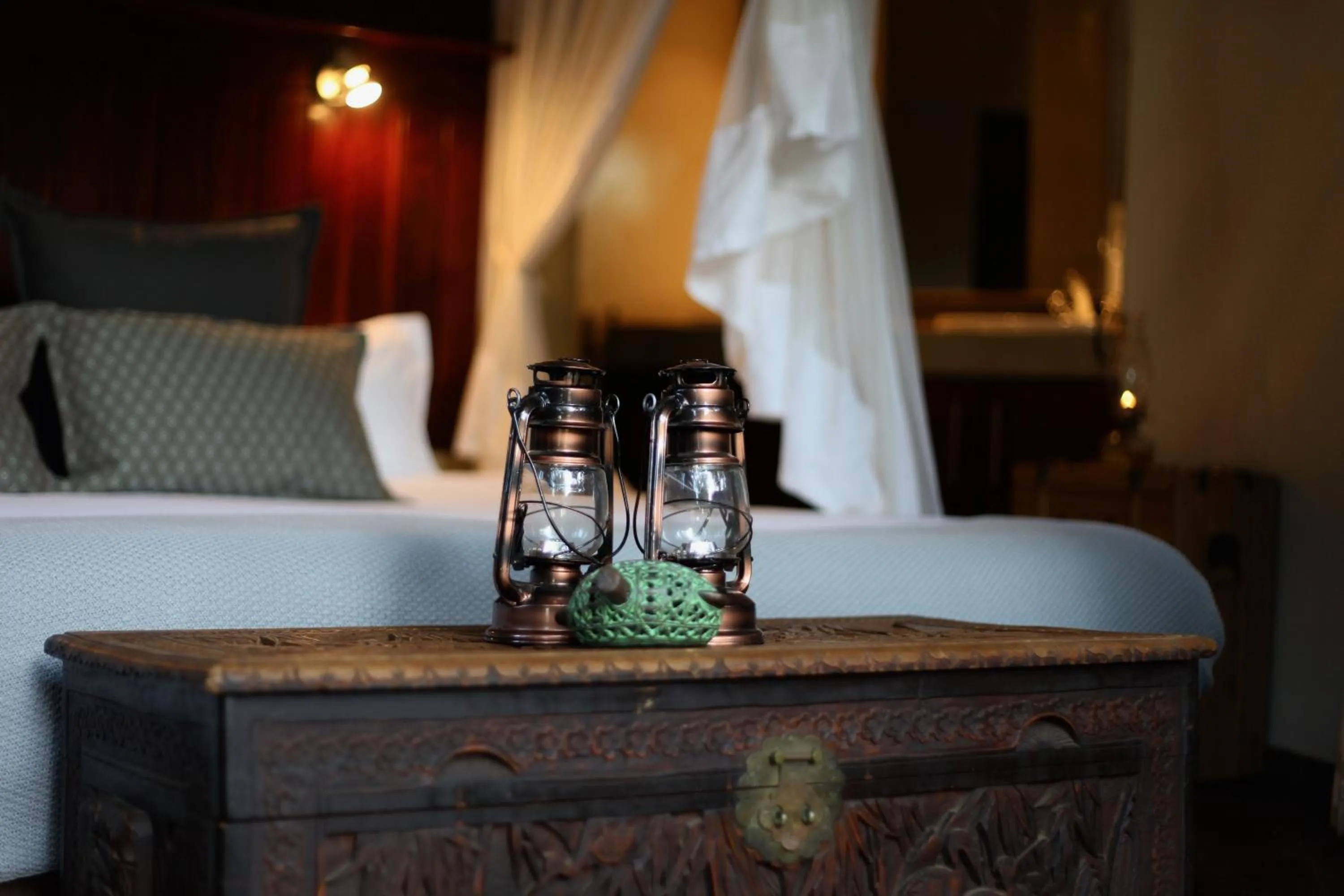 Bed in Ivory Wilderness River Rock Lodge