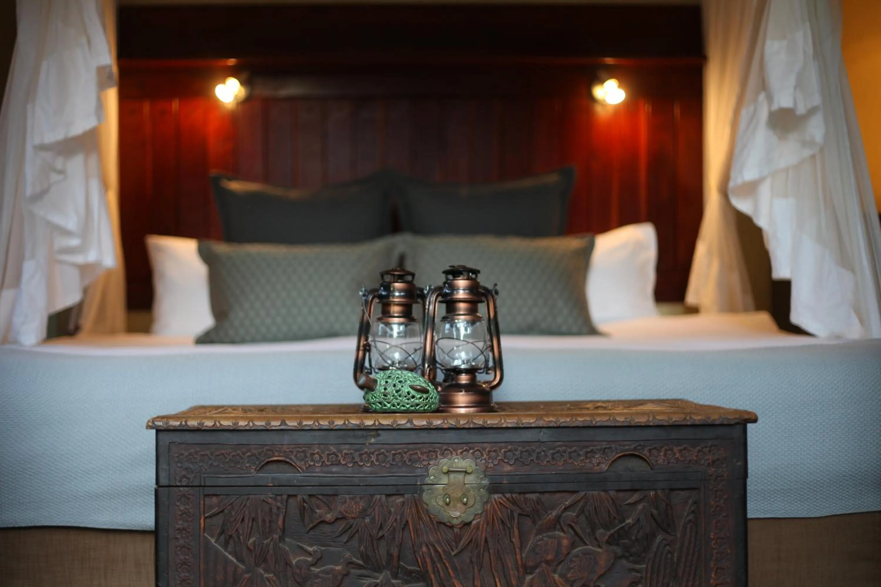 Bed in Ivory Wilderness River Rock Lodge