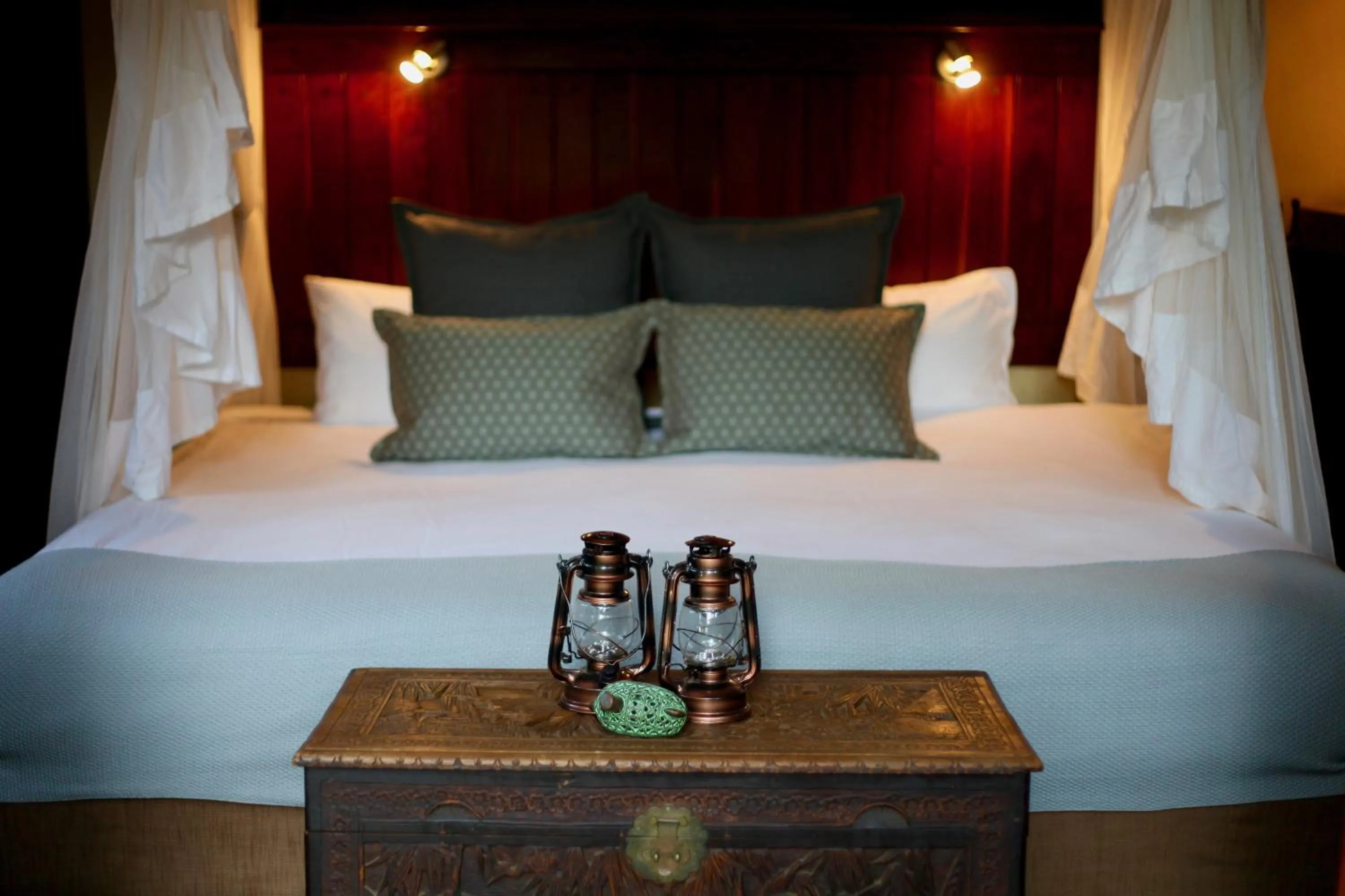 Bed in Ivory Wilderness River Rock Lodge