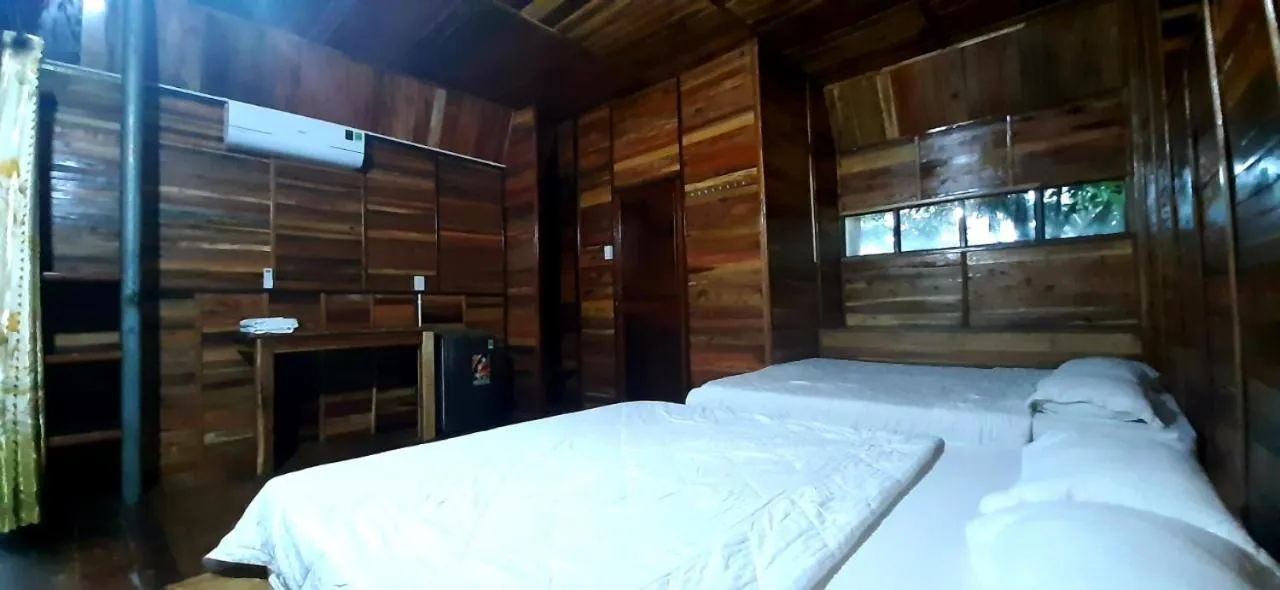 Bed in Green Bamboo Lodge Resort