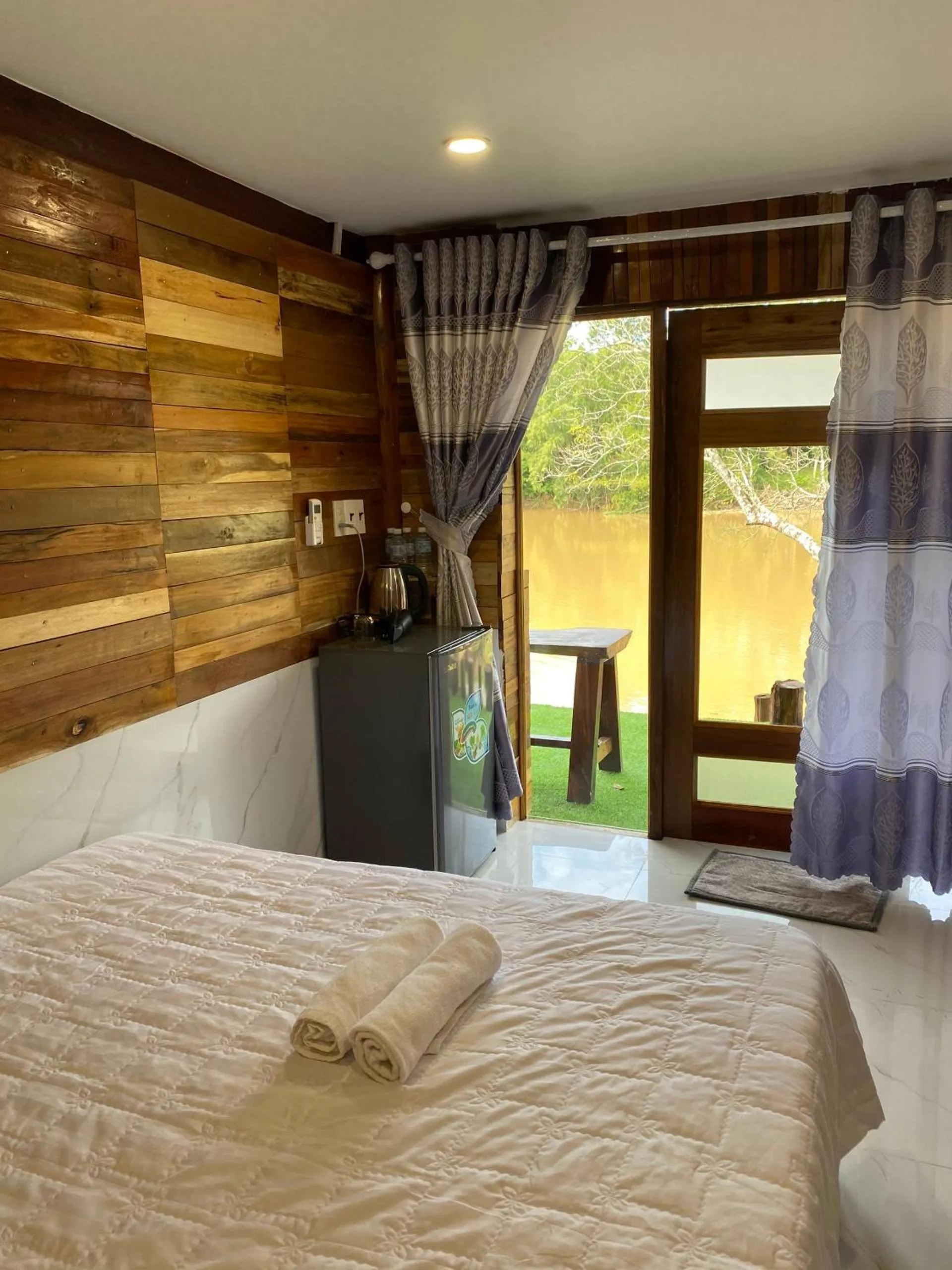 Bed in Green Bamboo Lodge Resort