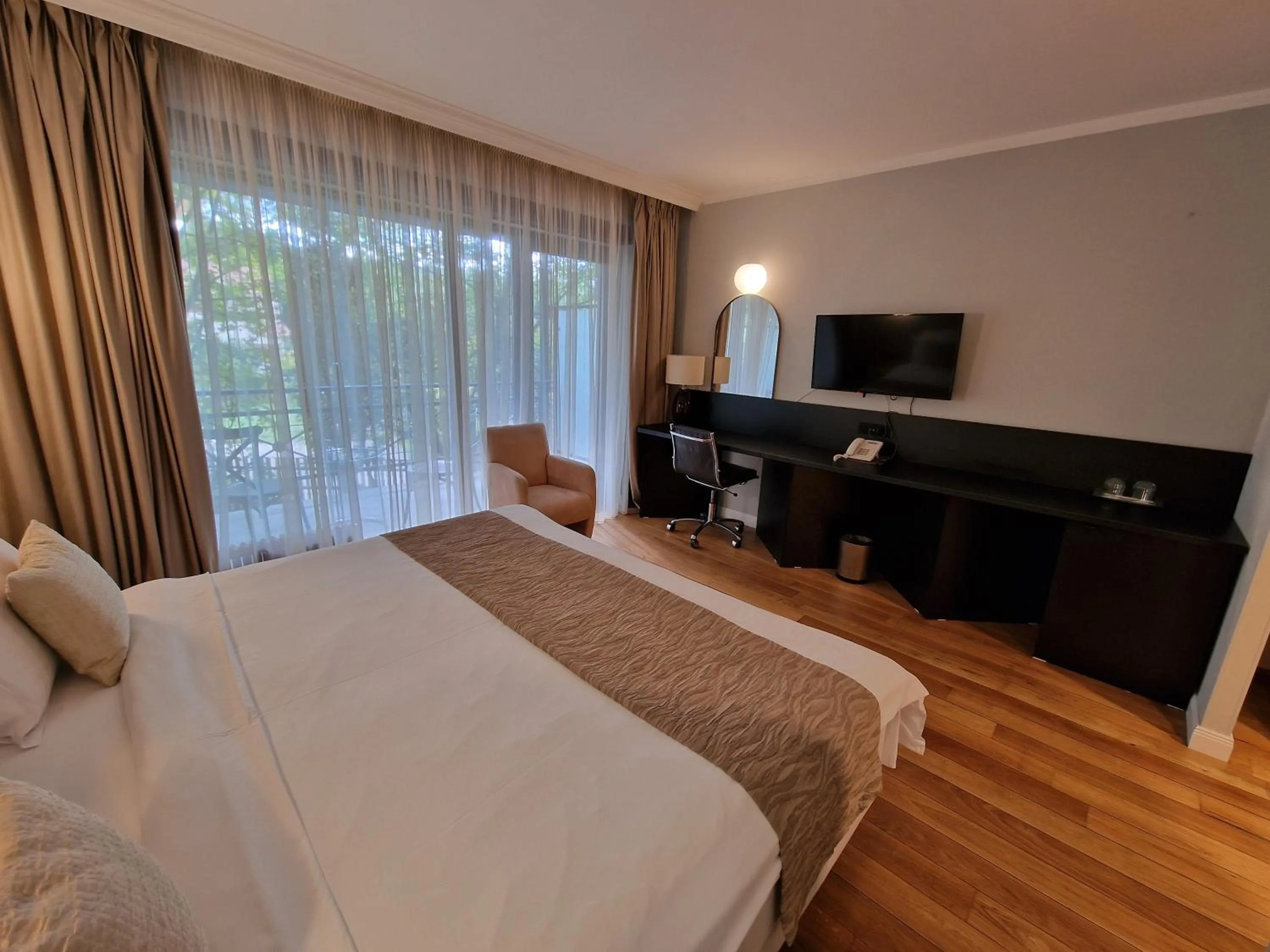 TV and multimedia, Bed in Hotel Sunny Hill