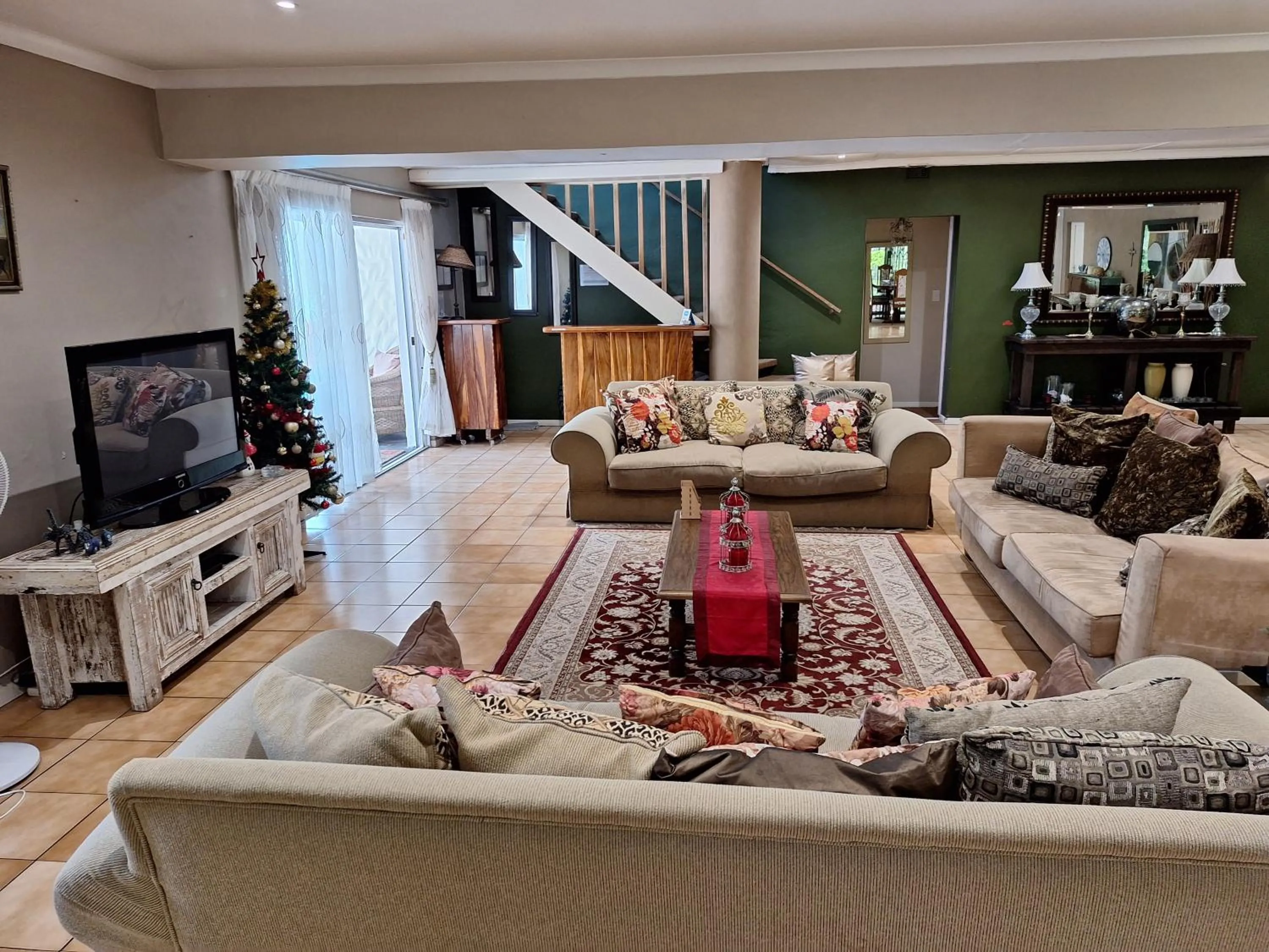 Communal lounge/ TV room in Umuzi Guest House