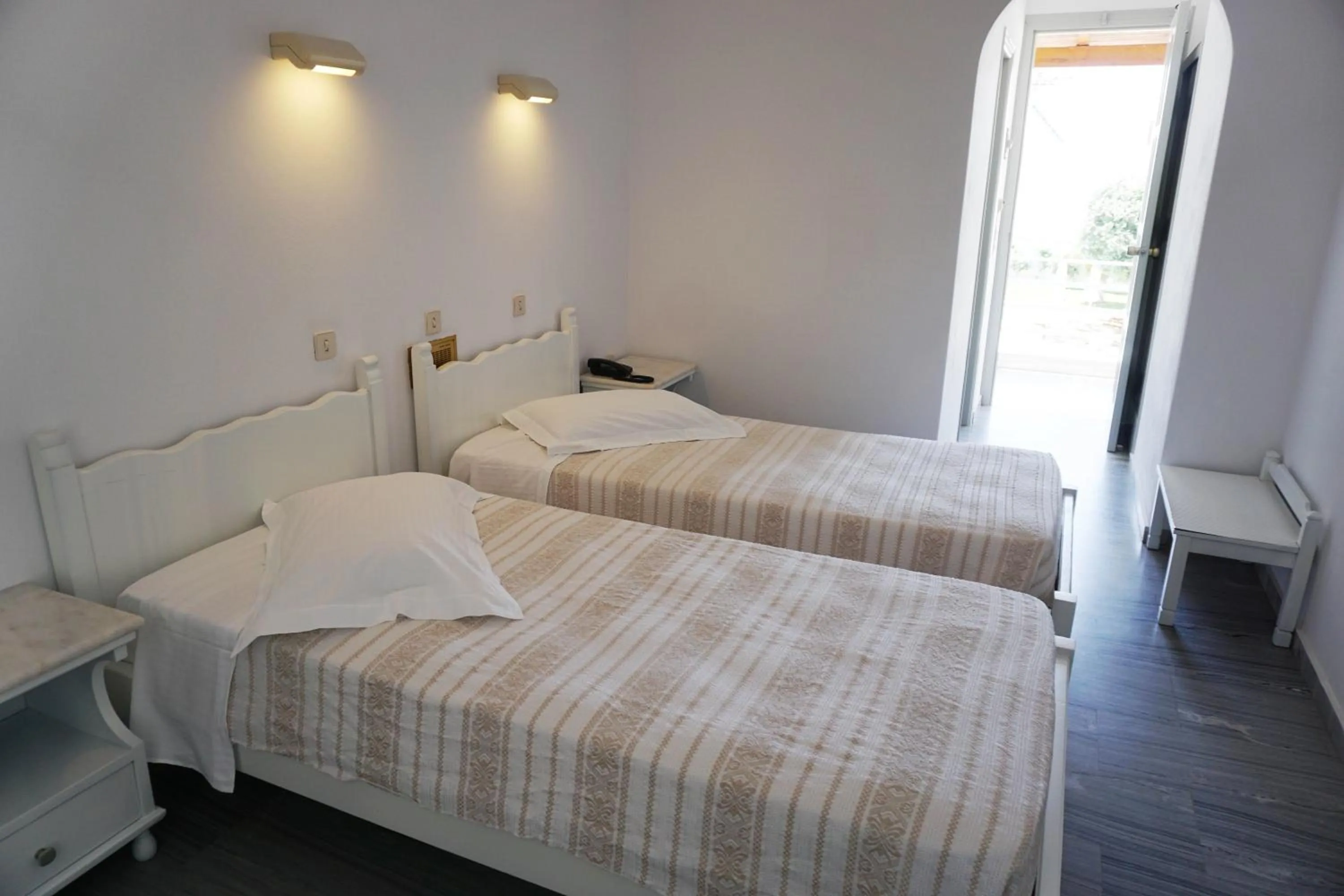 Text overlay, Bed in Polos Hotel Paros