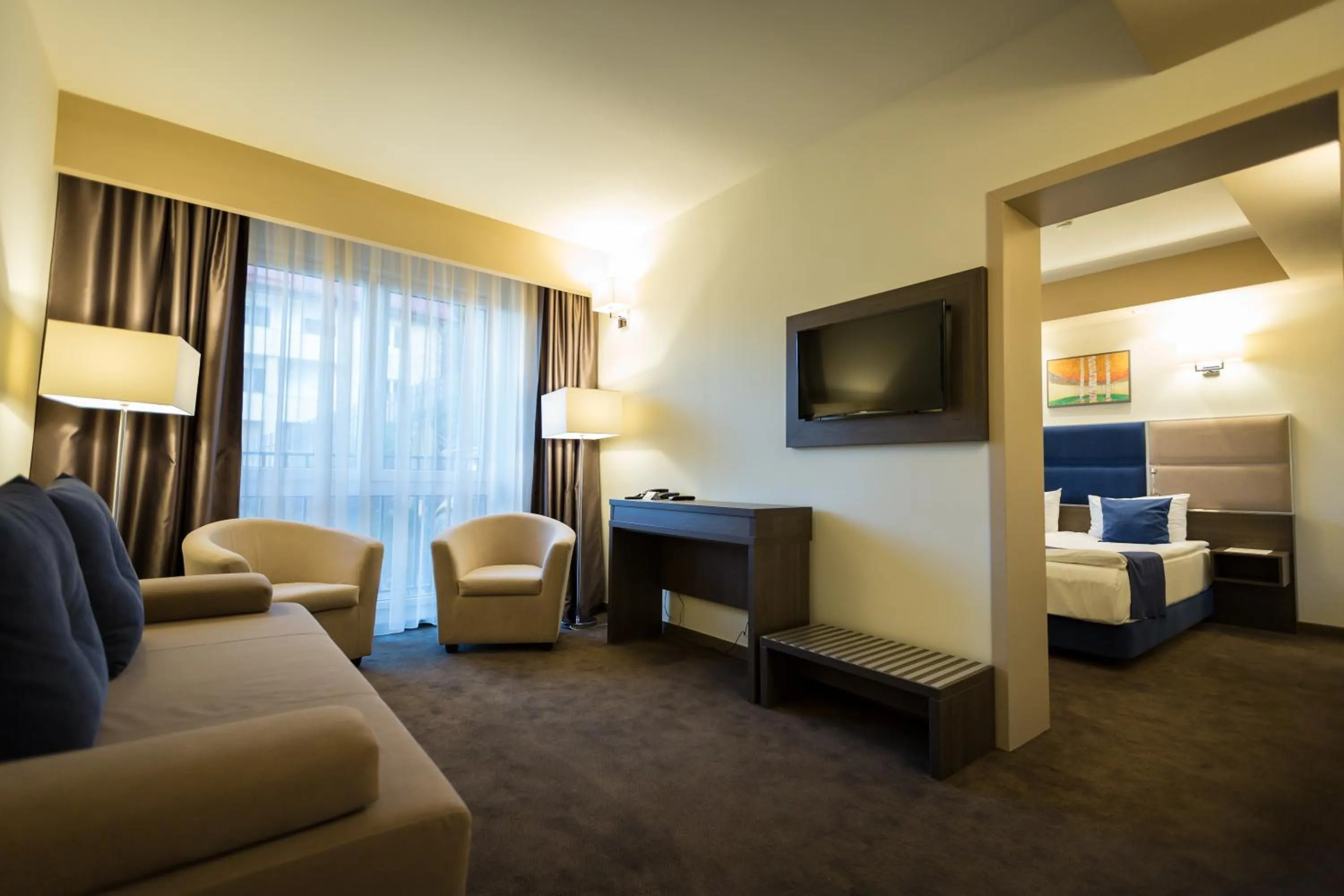 Living room, Bed in Belfort Hotel