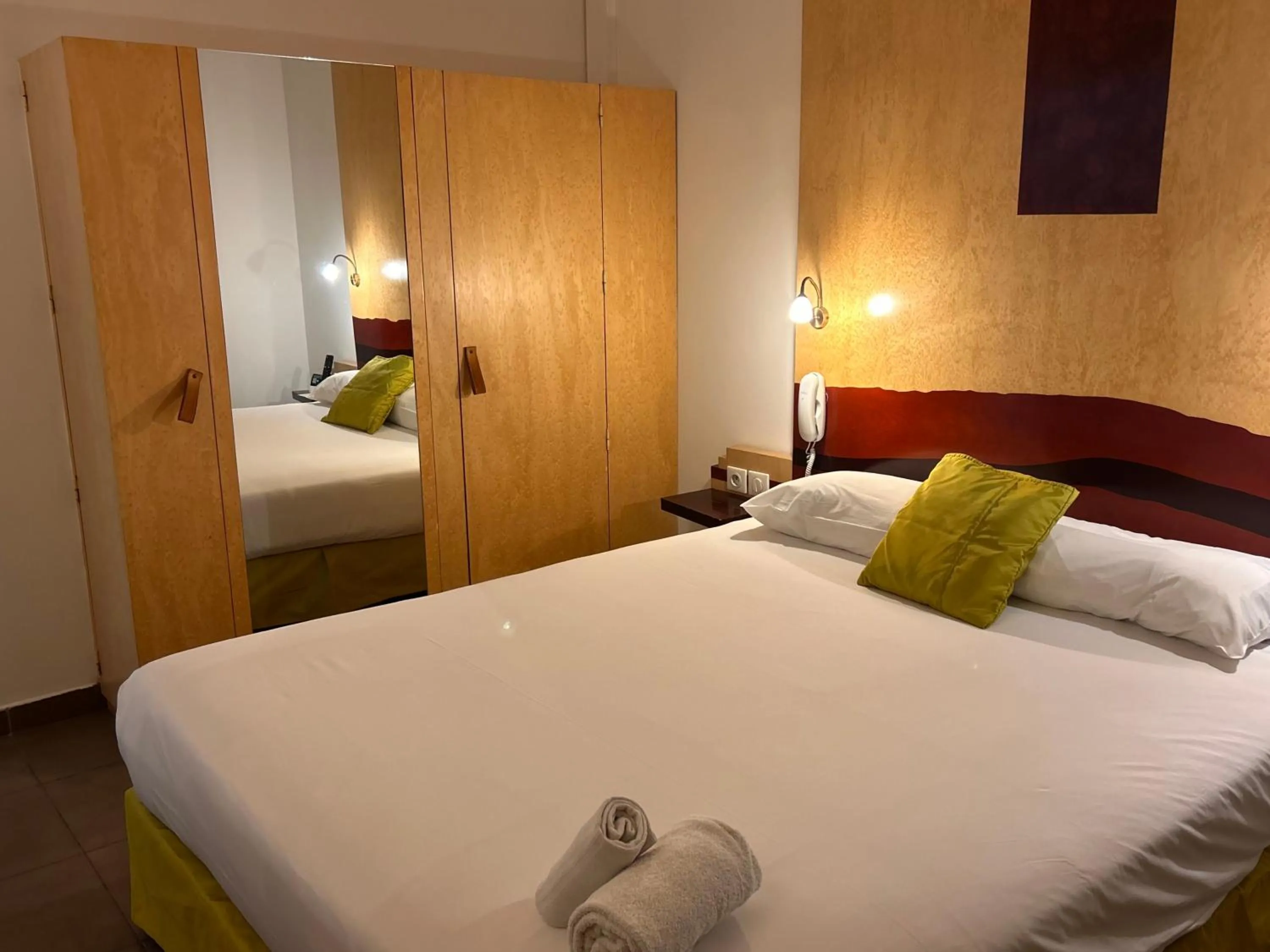 Bed in Logis Hôtel La Fauceille