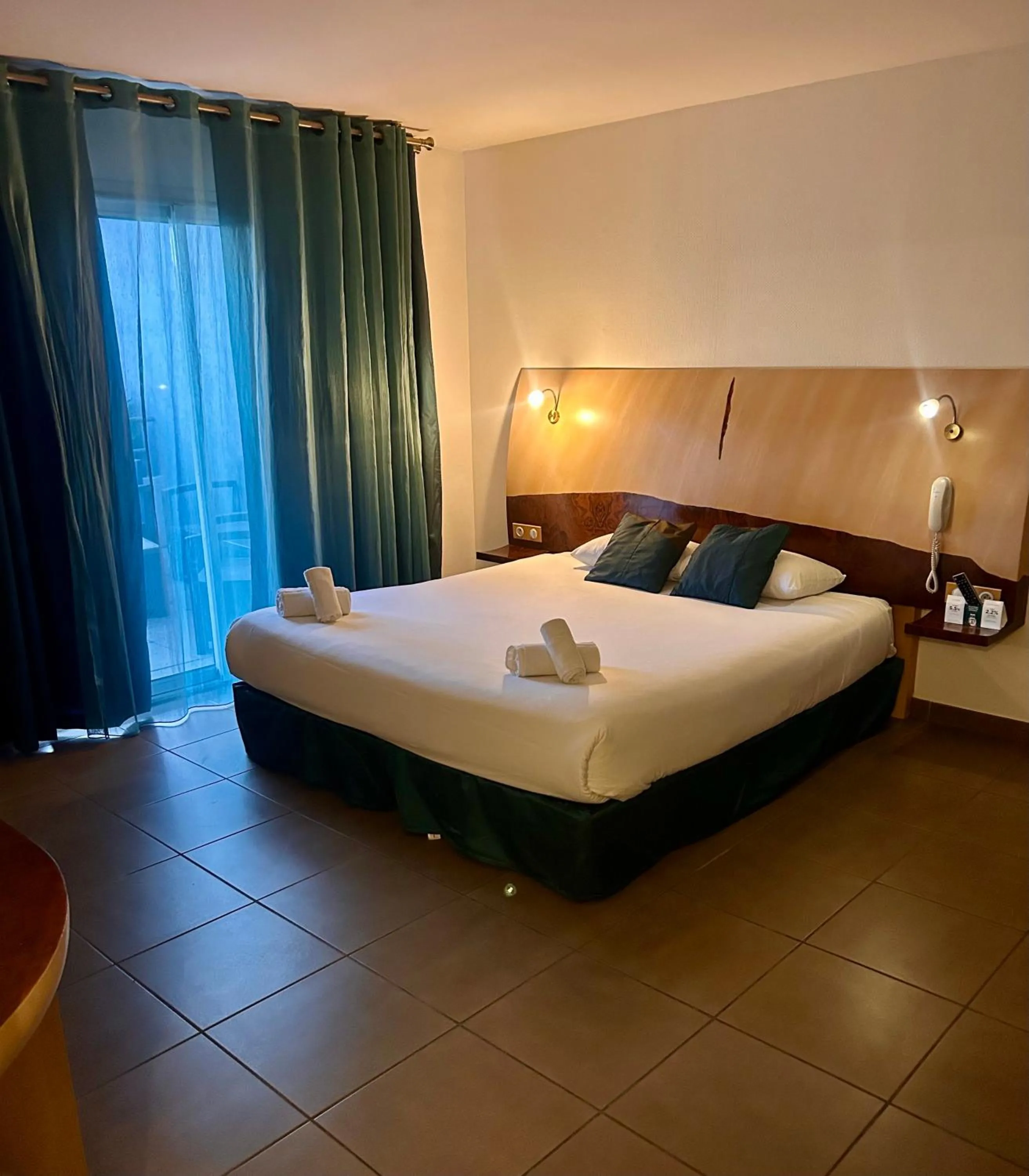 Bed in Logis Hôtel La Fauceille