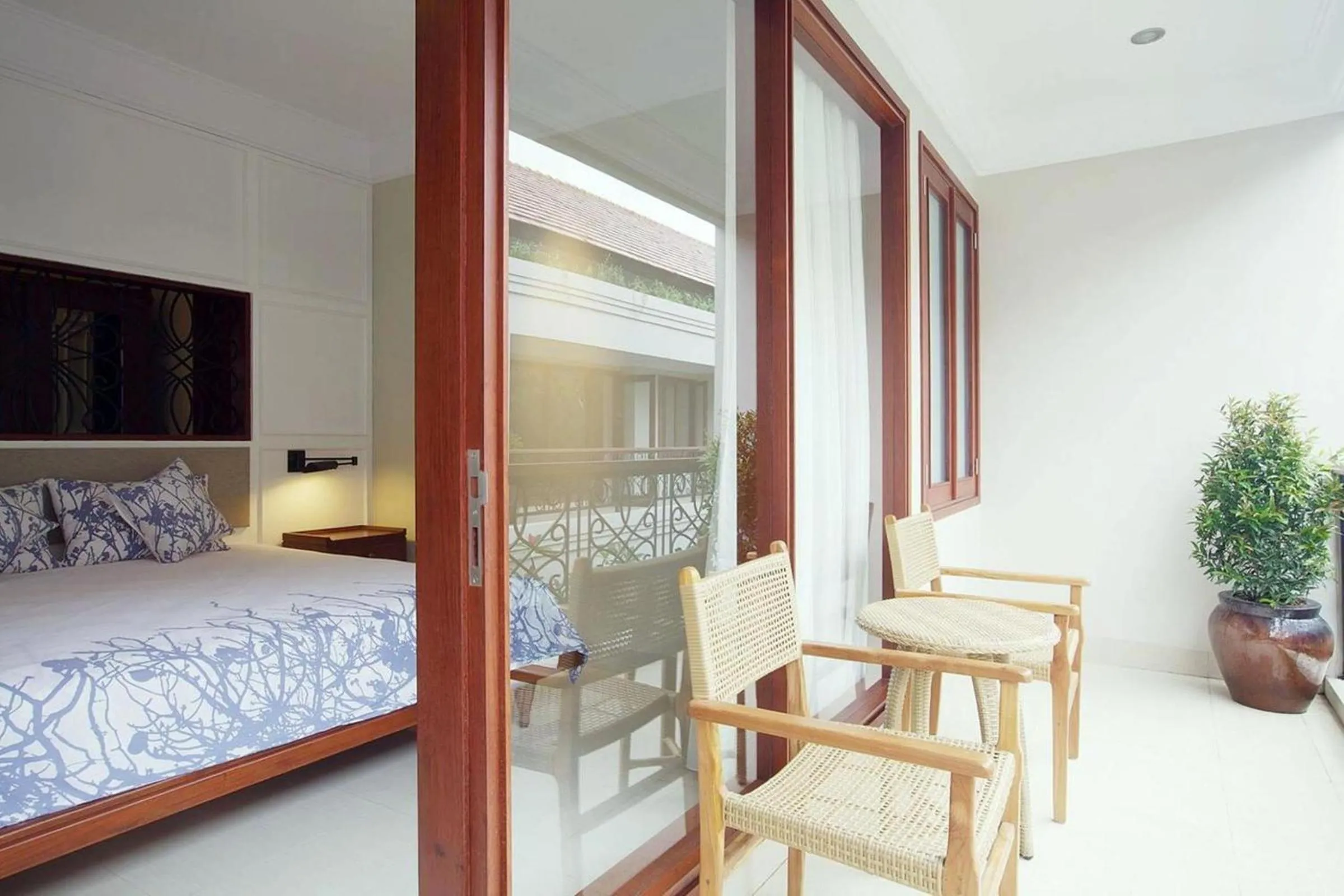 Balcony/Terrace, Bed in Seminyak Lagoon All Suites Hotel