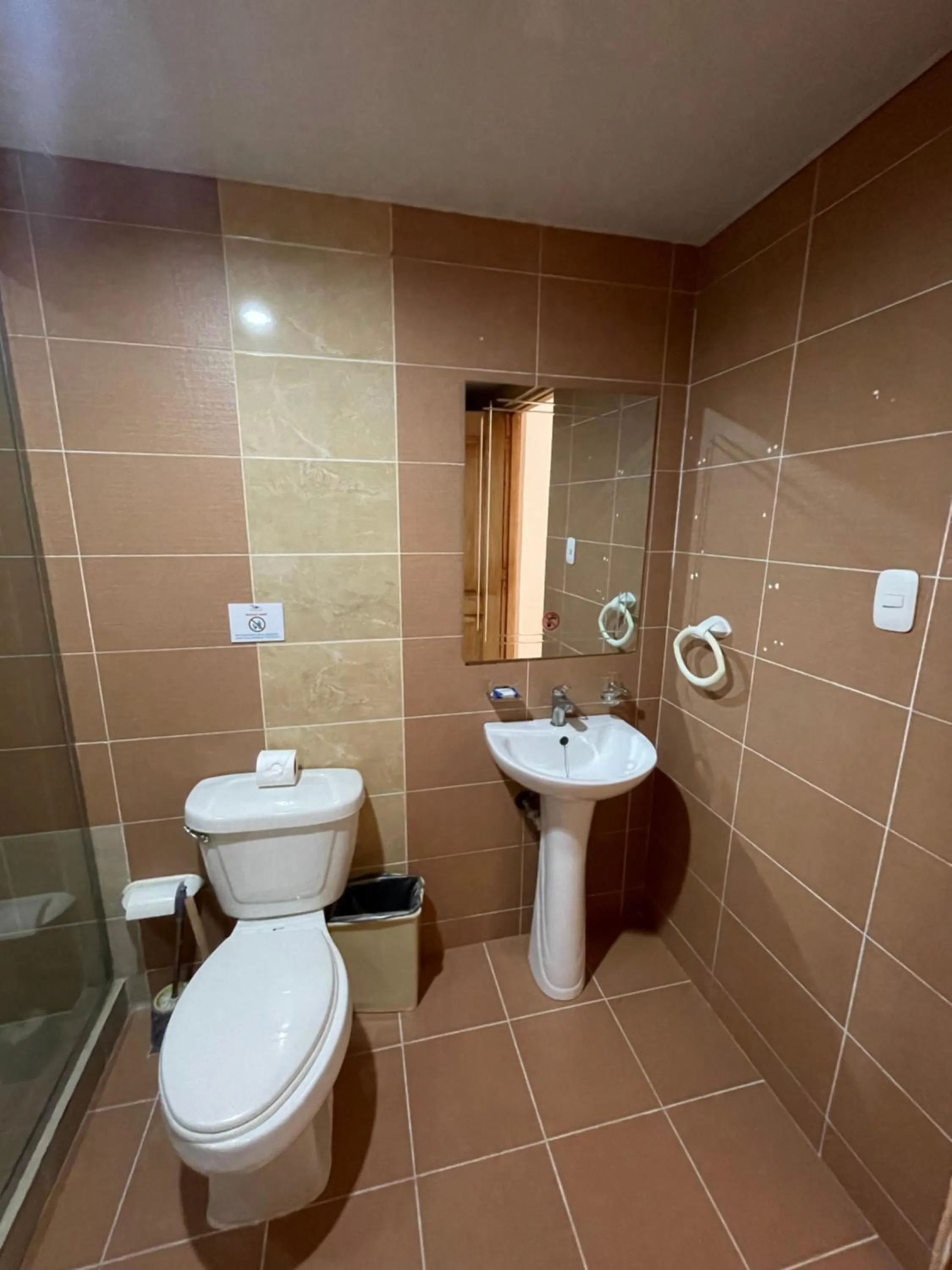 Toilet in Karimar Beach Condo Hotel