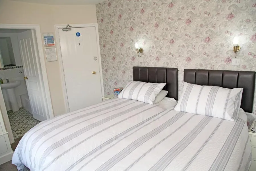 Bed in The Hinton Guest House