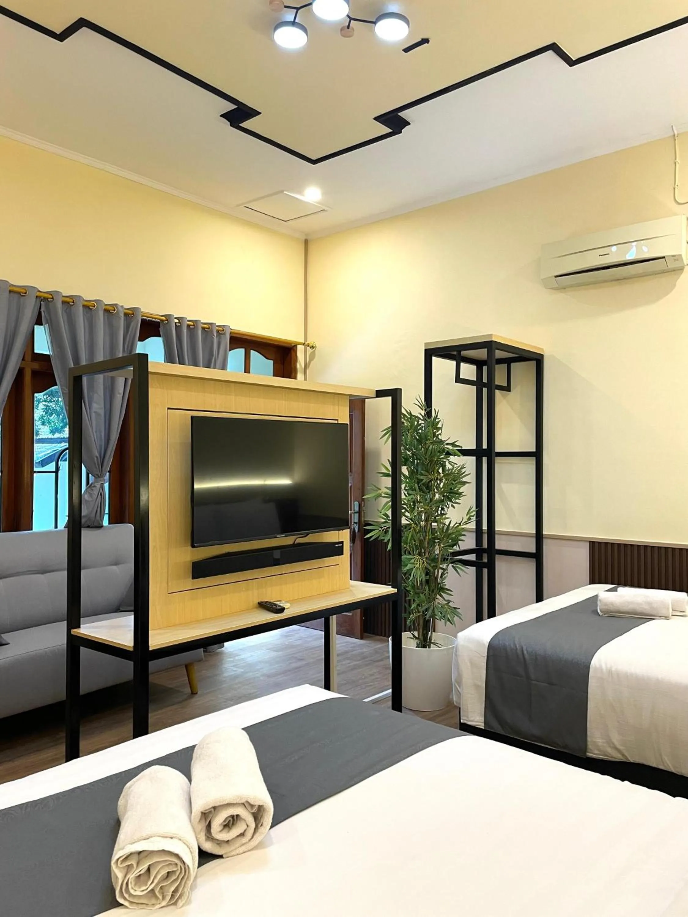 Living room, Bed in Berlian Abadi Hotel by Sinergi