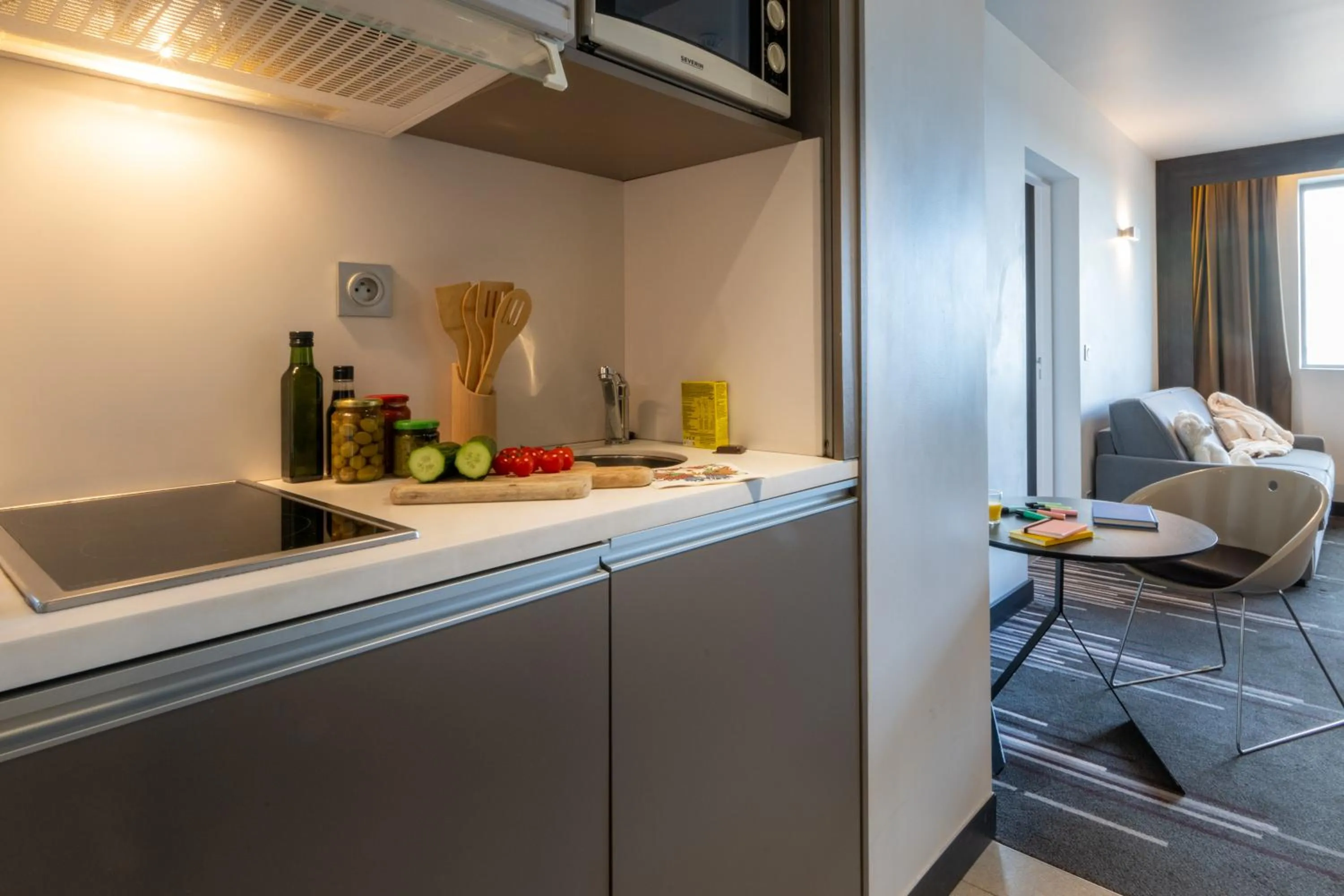 Kitchen or kitchenette in Nemea Appart Hotel Concorde Toulouse Gare Matabiau