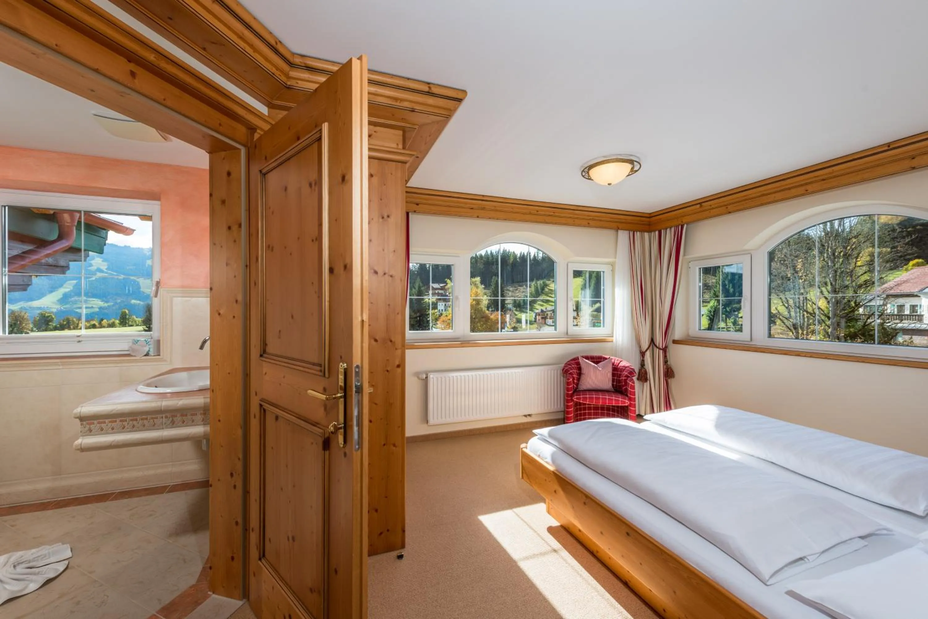 Bathroom, Bed in Hotel Ennstalerhof