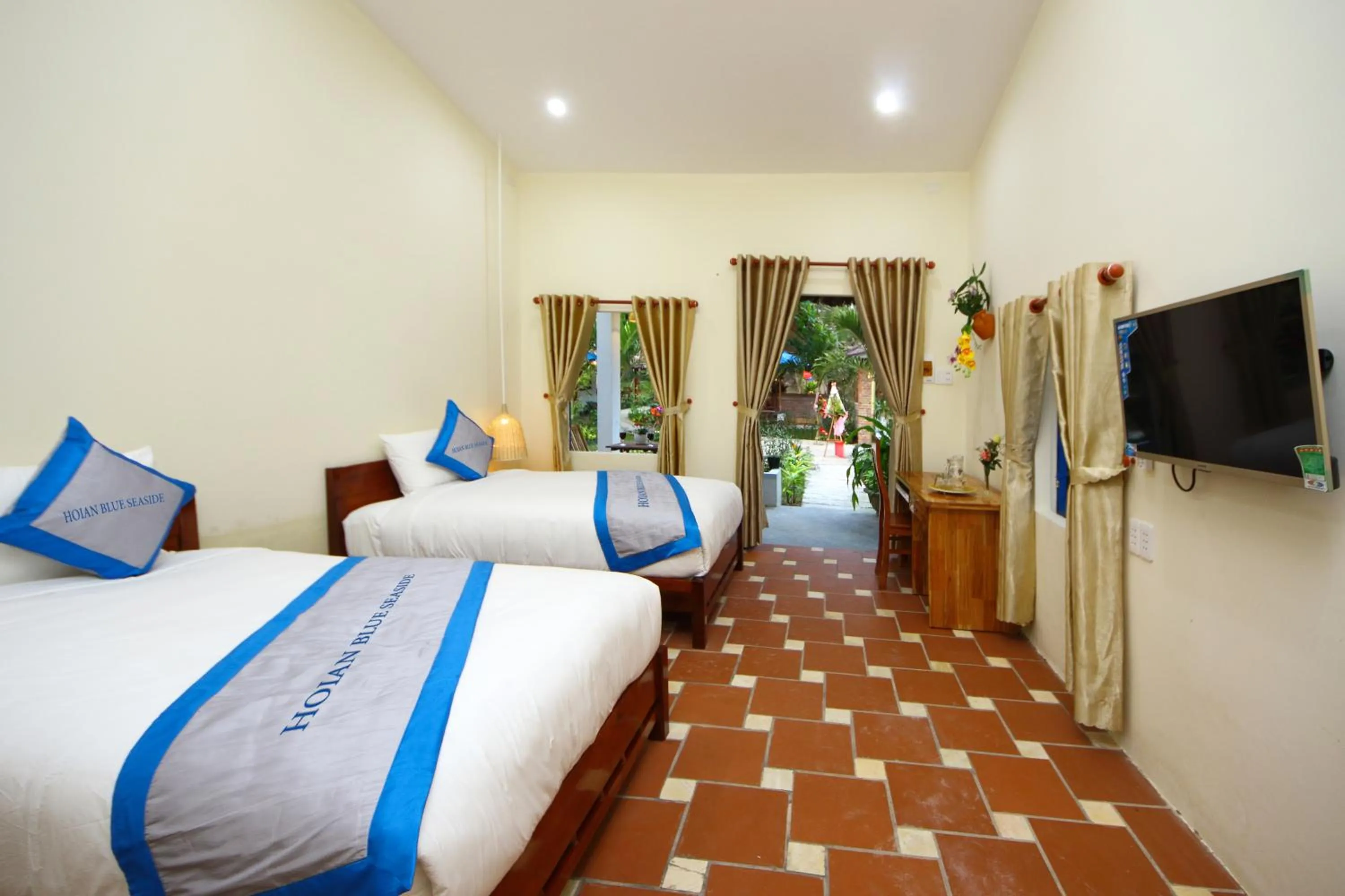 Communal lounge/ TV room, Bed in Hoi An Blue Seaside Homestay