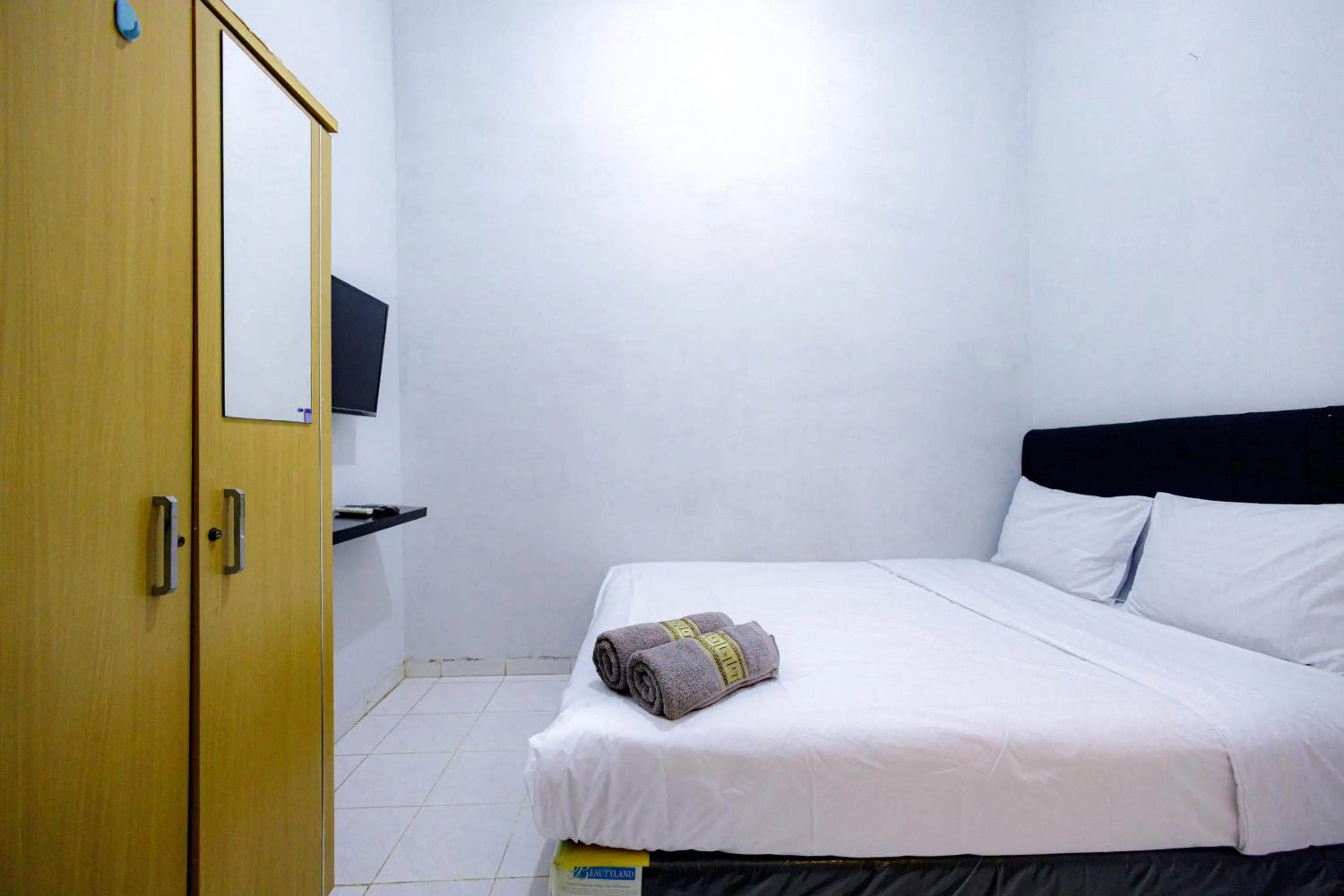 Bed in Marcello Residence Siwalankerto near Petra University Surabaya Mitra RedDoorz