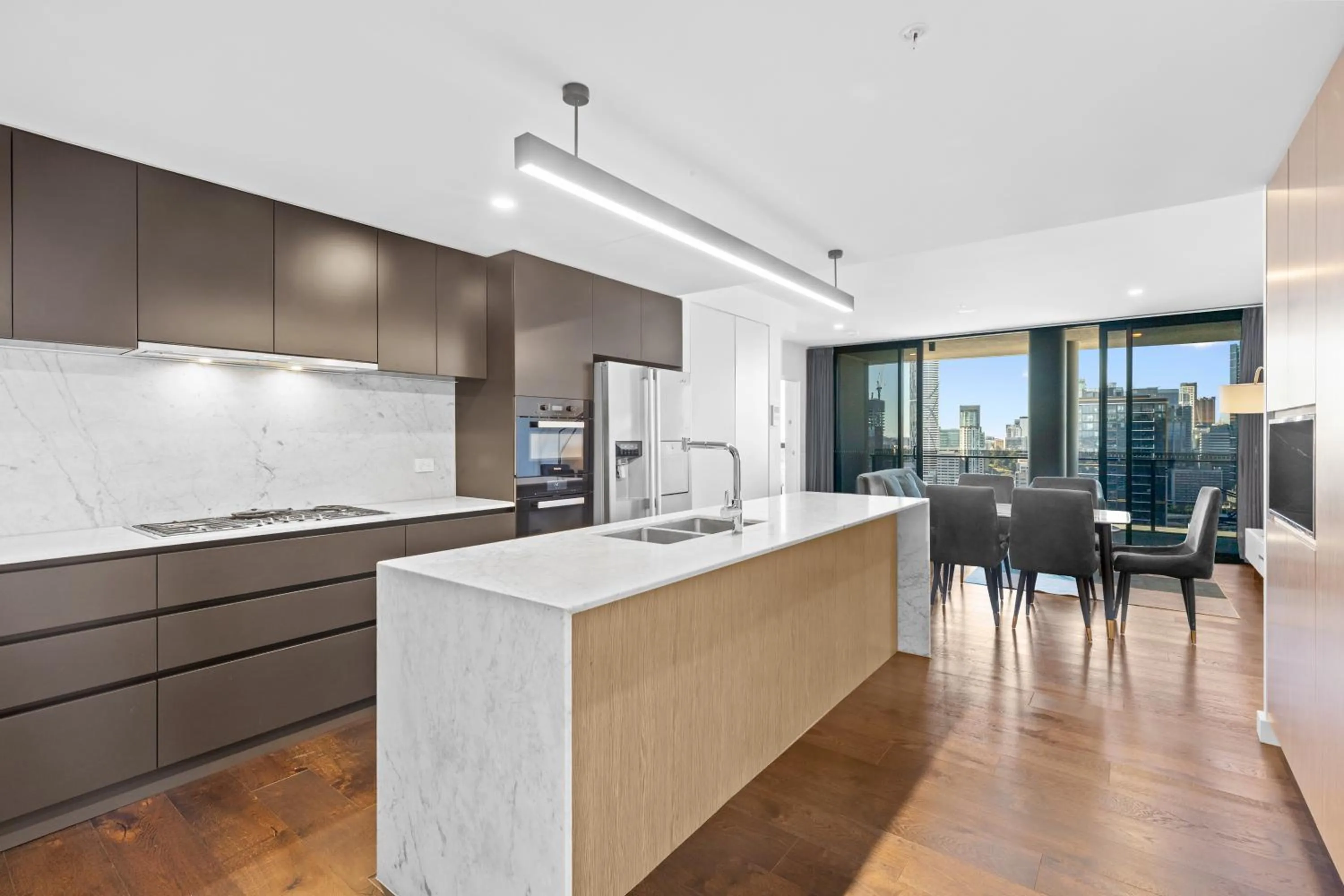 kitchen in Brisbane One Apartments by CLLIX